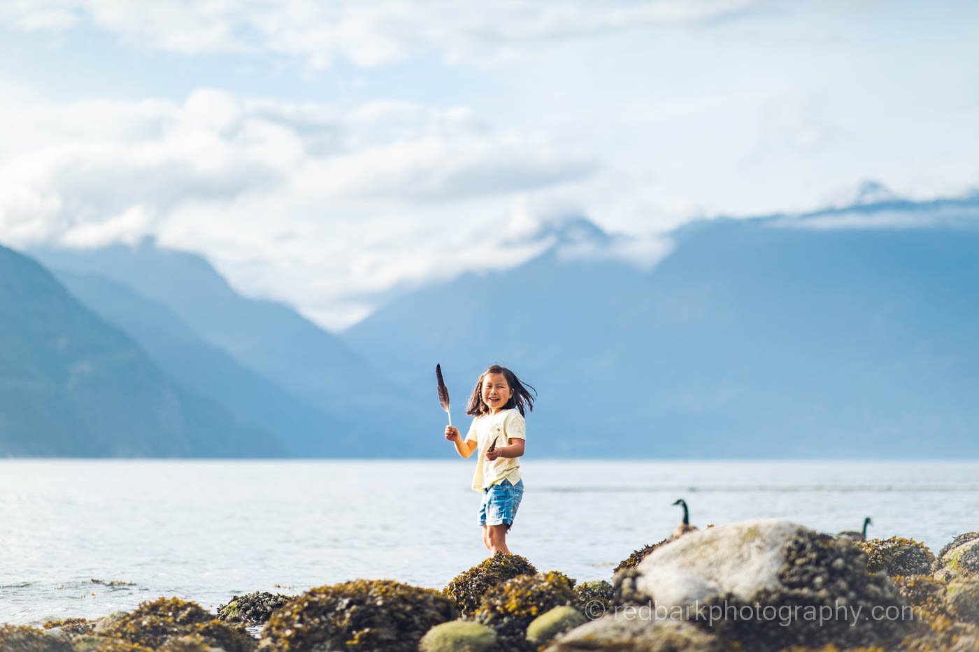 Furry Beach Child with feather Child photography
