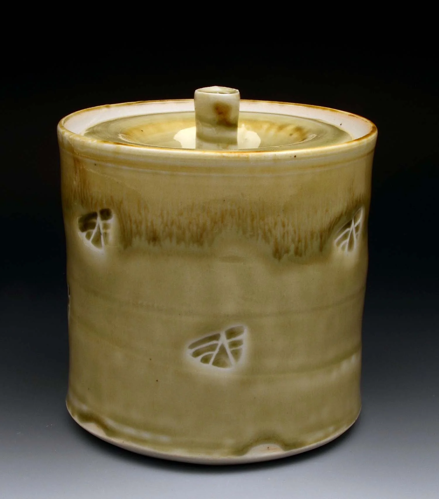 Porcelain, wood ash glaze, iron wash.