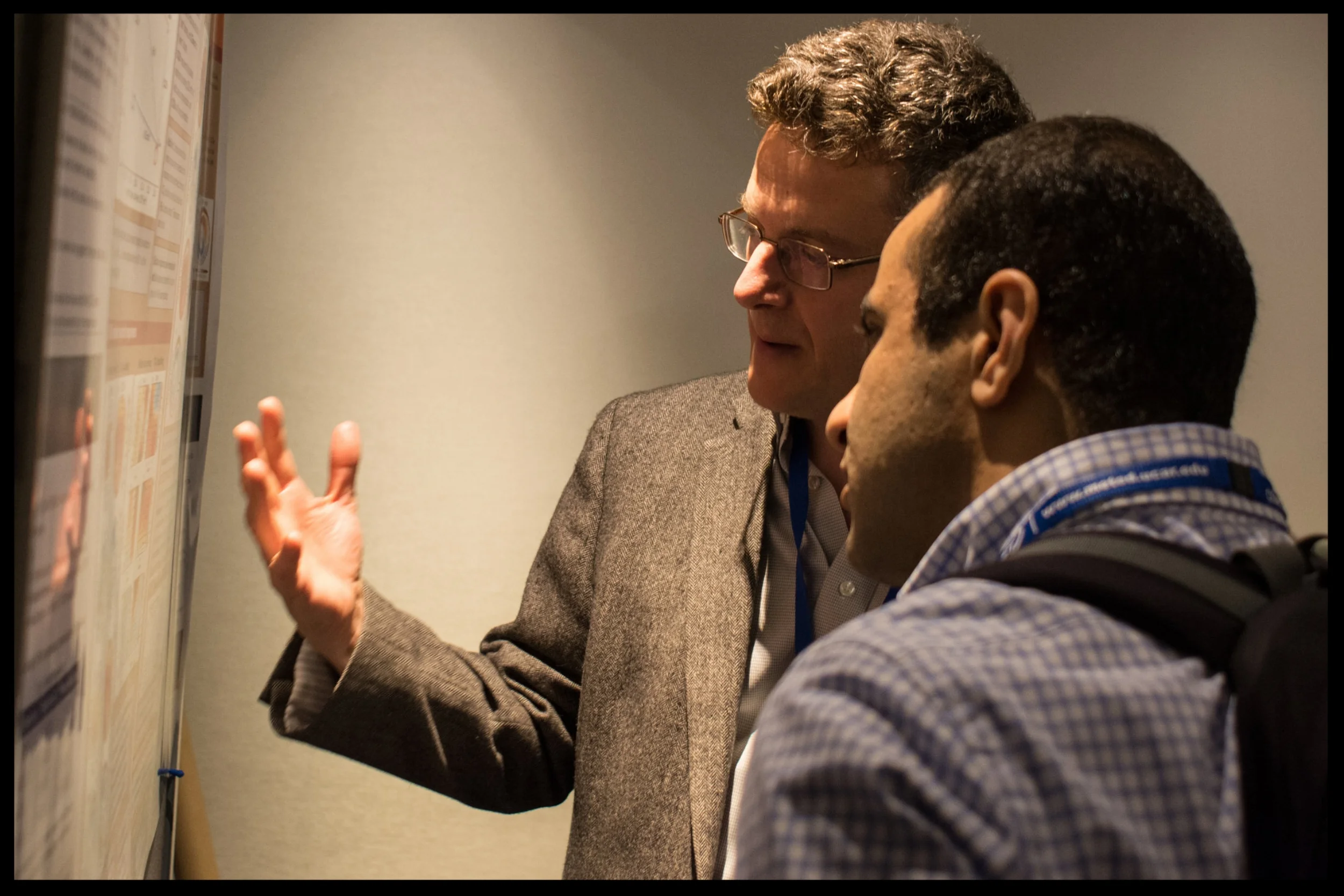 Paul, with Ali Moridnejad, discussing Kelly McCusker's poster at the 2017 CMOS Congress in Toronto. Photo by Dan Weaver.