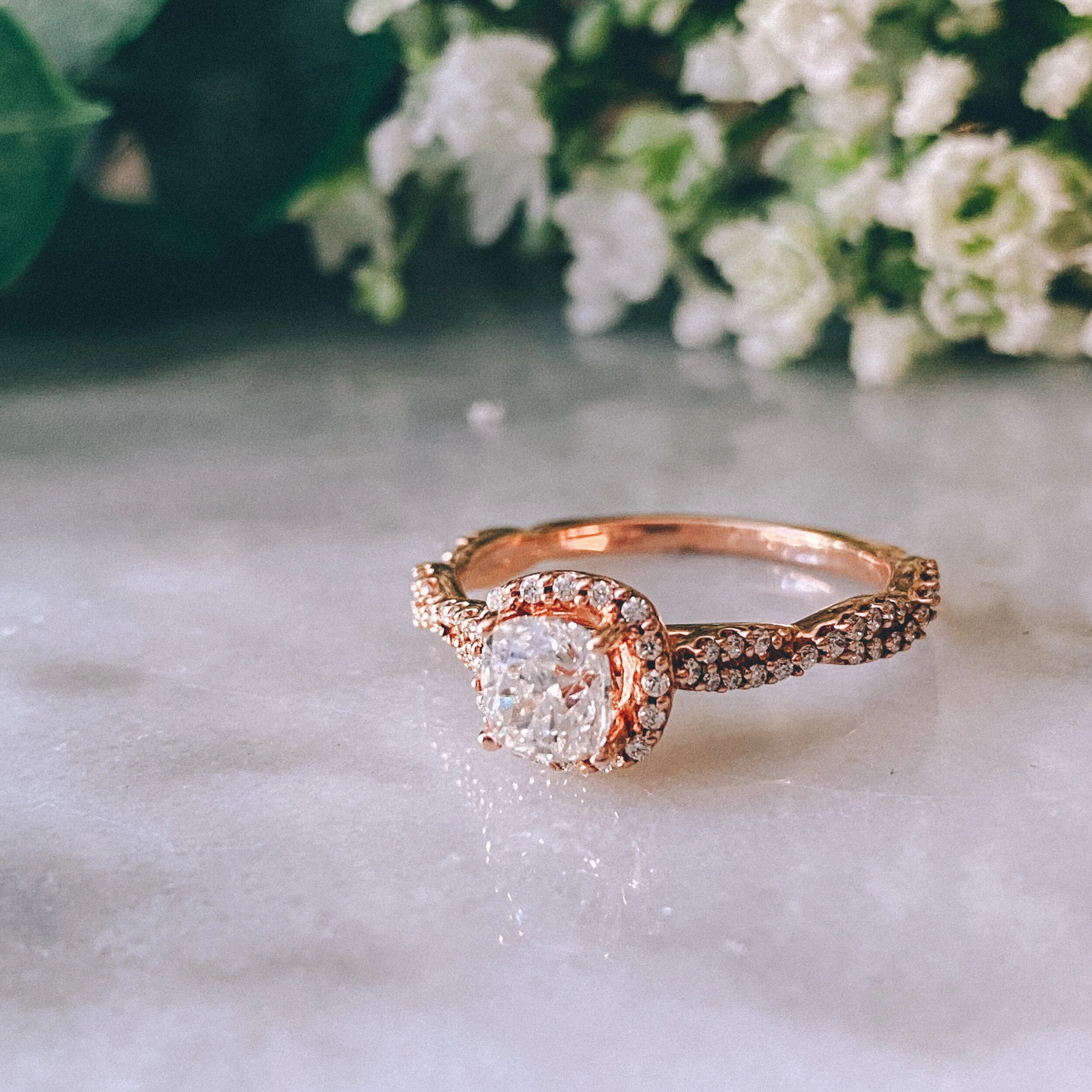 14k Rose Gold 0.52ct Cushion Diamond (I1/H) Twist Engagement Ring with 0.26cttw Diamond Halo + Accents (I/G-H)