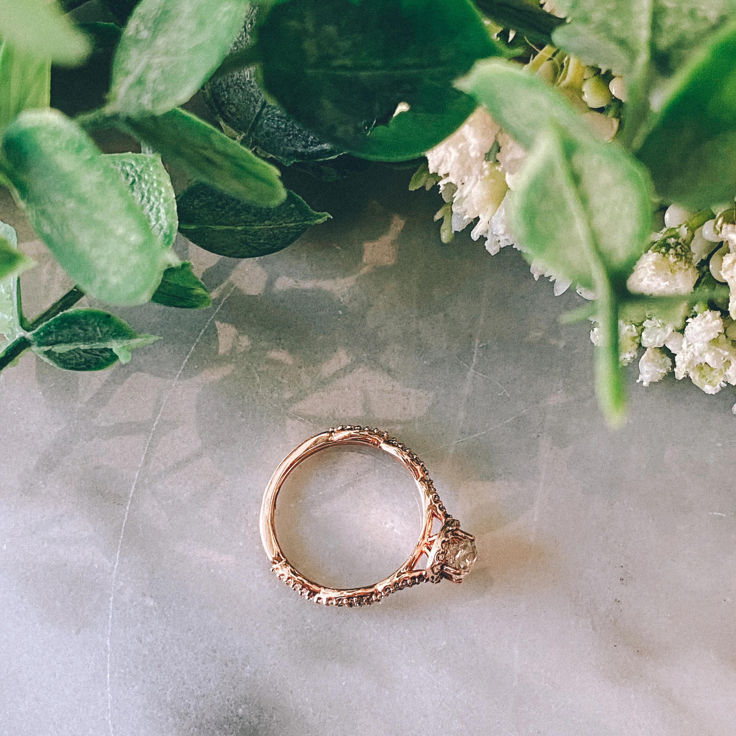 14k Rose Gold 0.52ct Cushion Diamond (I1/H) Twist Engagement Ring with 0.26cttw Diamond Halo + Accents (I/G-H)