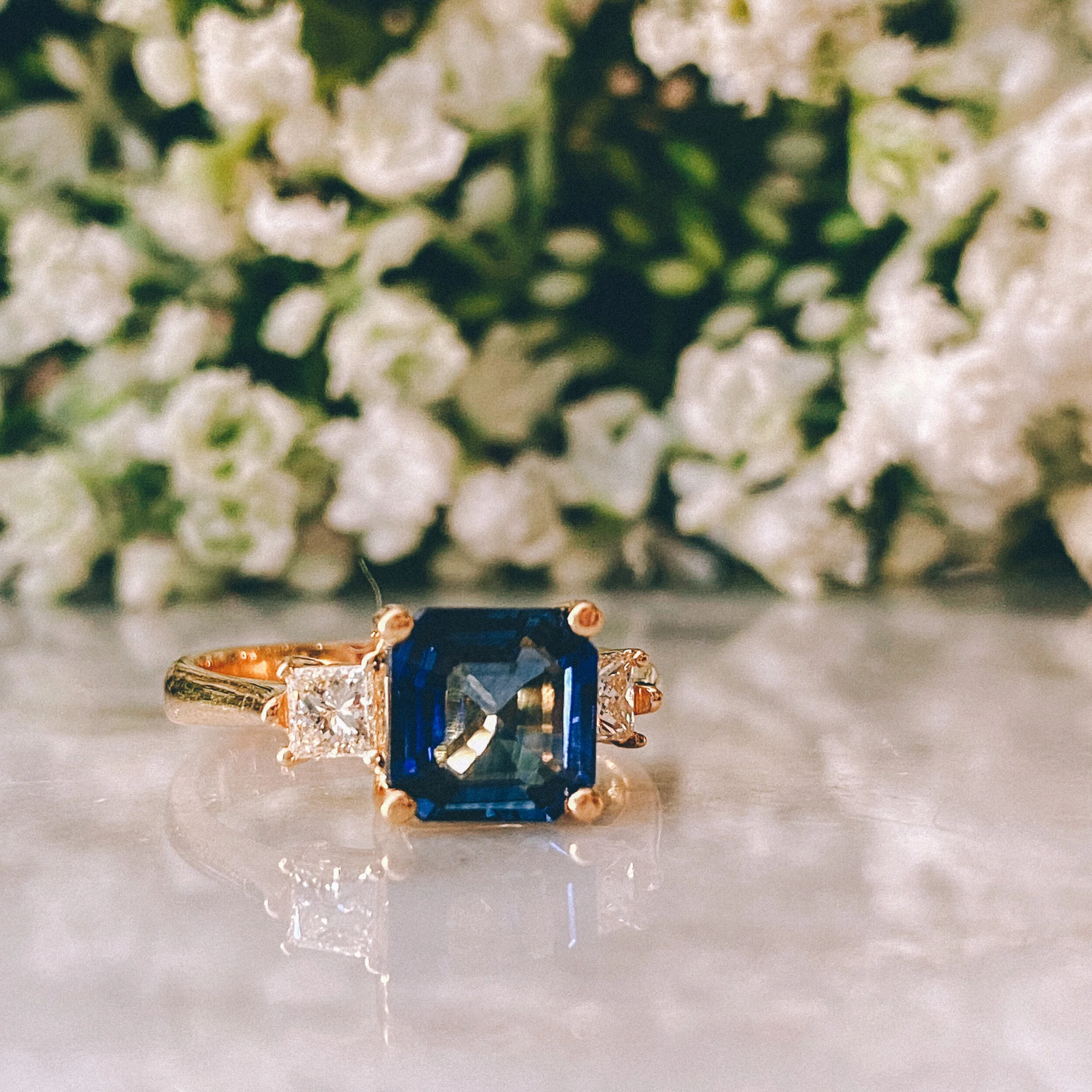 18k Yellow Gold 2.28ct Asscher Blue Sapphire Three-Stone Ring with 0.40cttw Princess Cut Diamonds (VVS1-2/G-H)