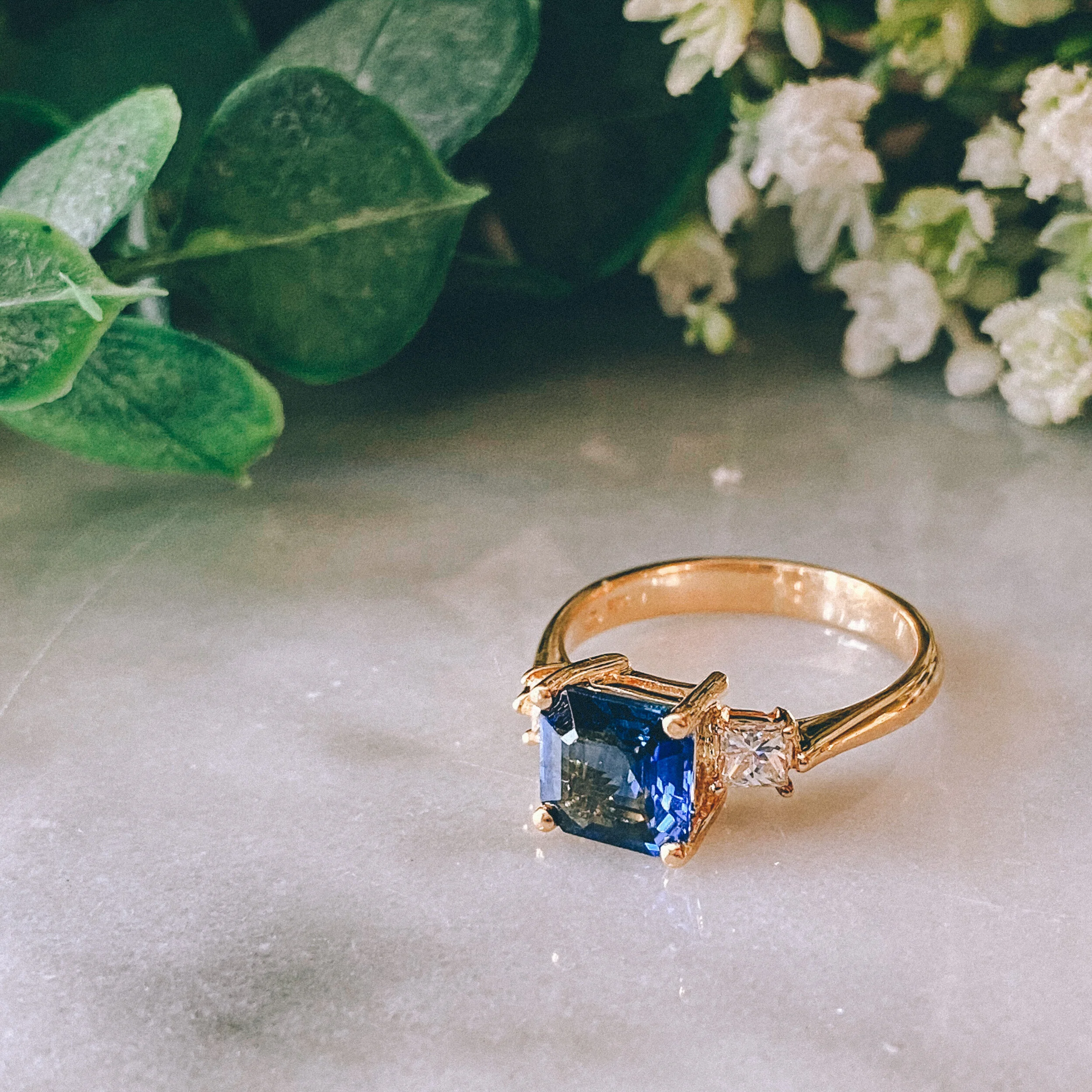 18k Yellow Gold 2.28ct Asscher Blue Sapphire Three-Stone Ring with 0.40cttw Princess Cut Diamonds (VVS1-2/G-H)