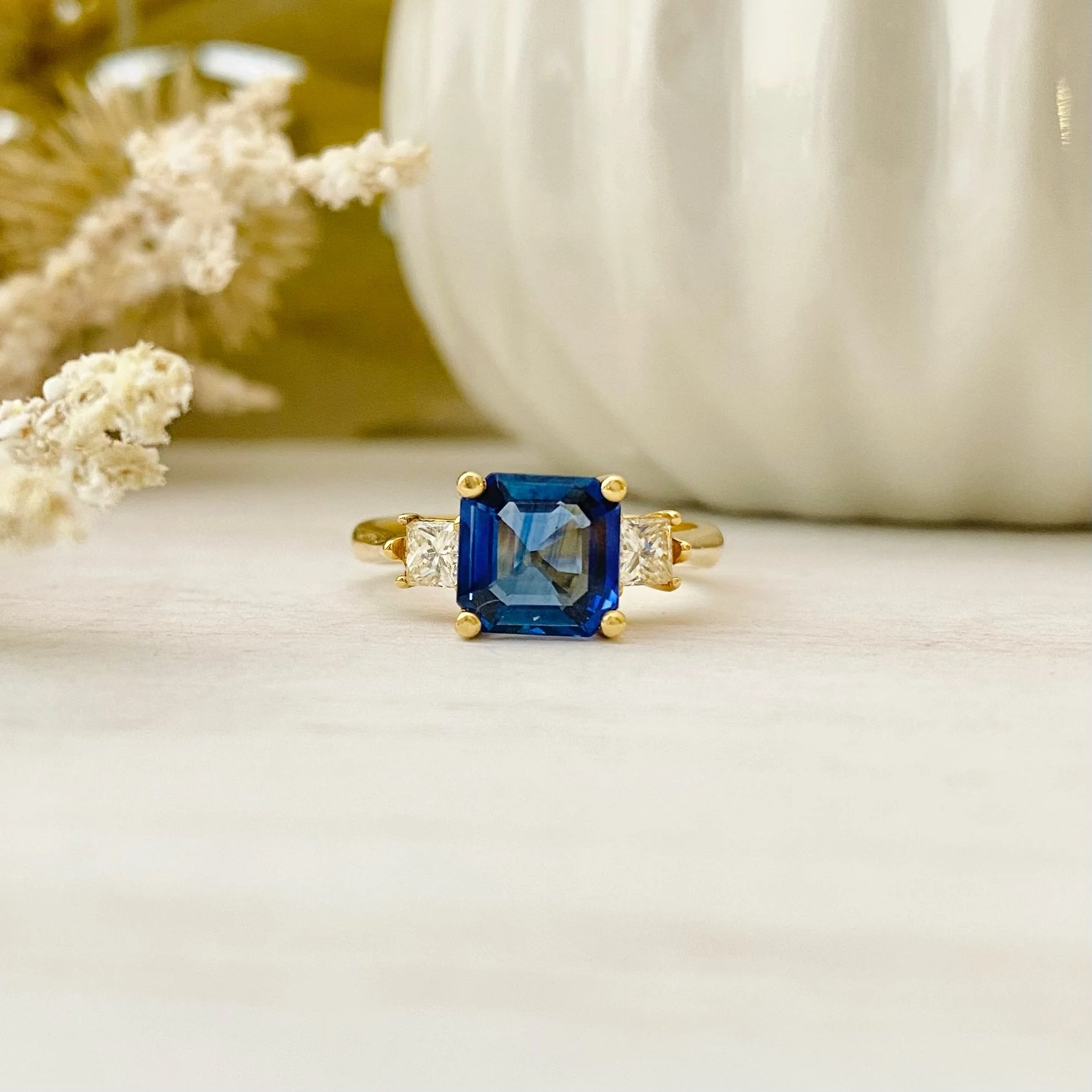 18k Yellow Gold 2.28ct Asscher Blue Sapphire Three-Stone Ring with 0.40cttw Princess Cut Diamonds (VVS1-2/G-H)