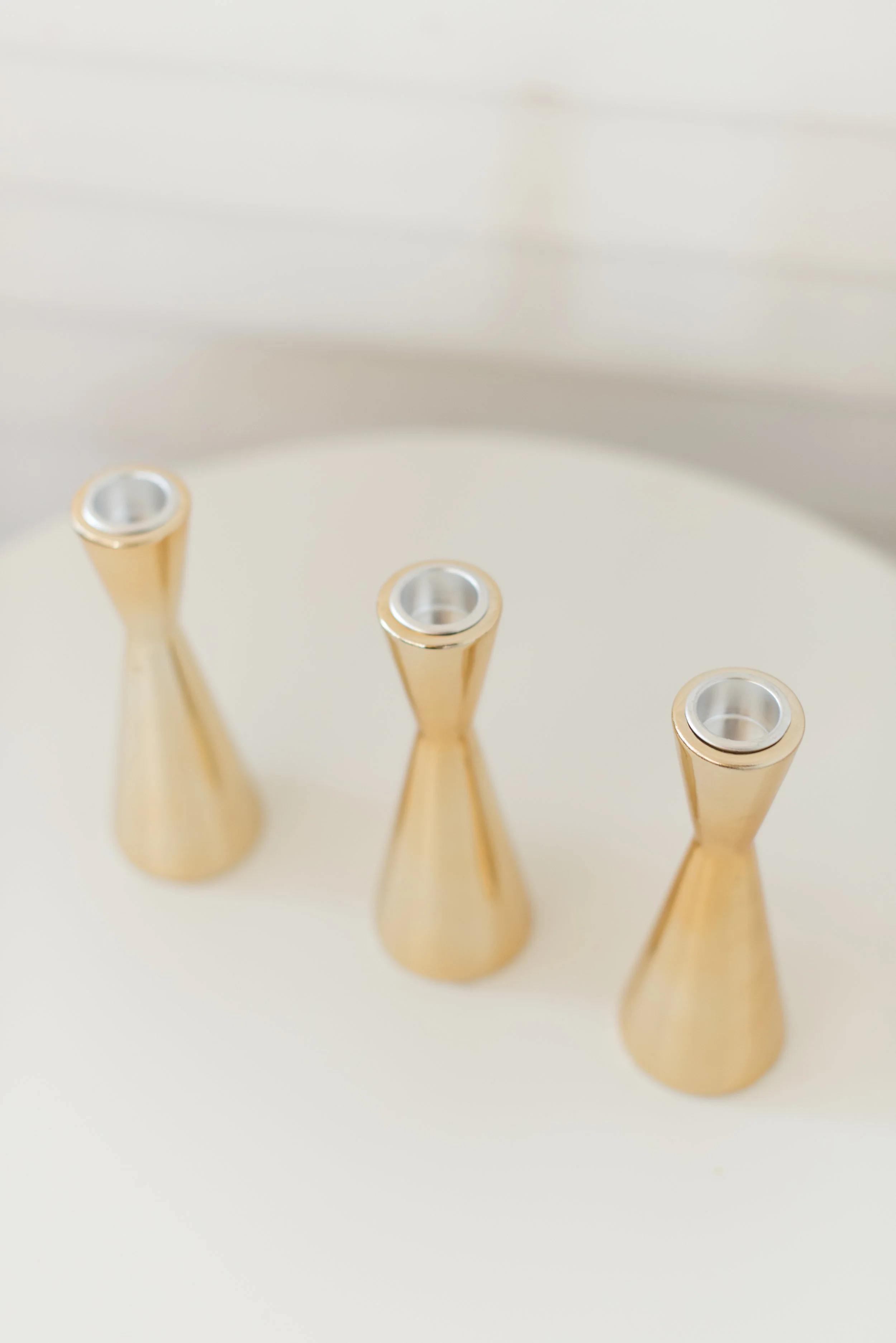 Gold figure eight candlesticks