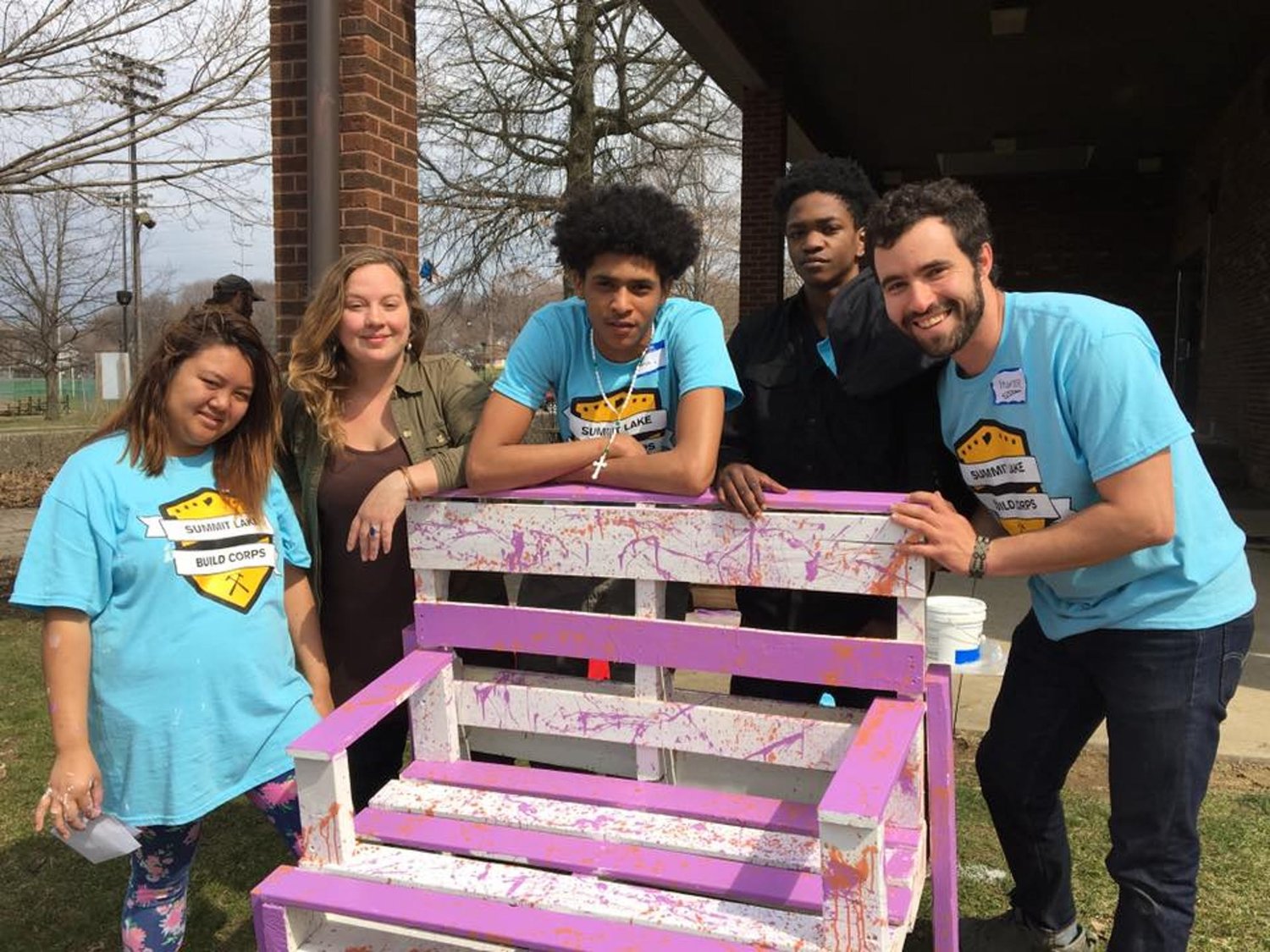 Members of the Summit Lake Build Corps pose with their finished bench. From left to right, Julie, League of Creative Interventionists fellow Megan Shane, Ramon, Markado, and League founder Hunter Franks.