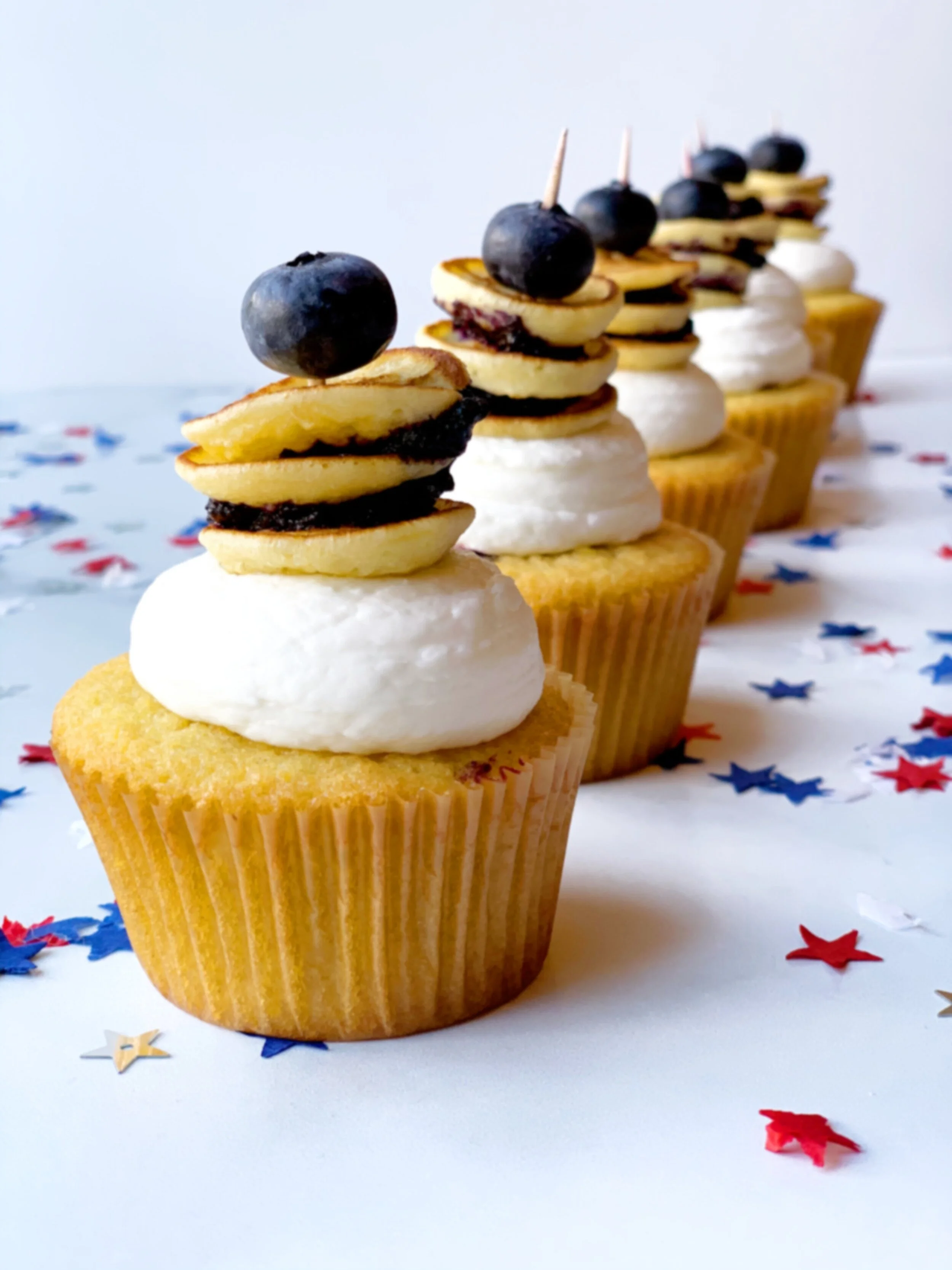 row of blueberry cupcakes.JPG