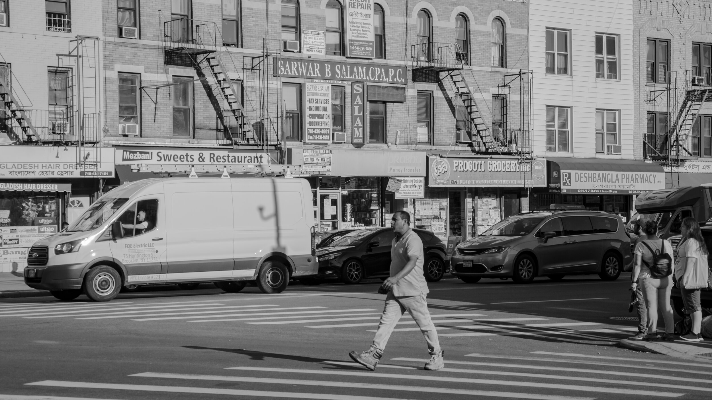 dude crossing street with boots b.w.jpg
