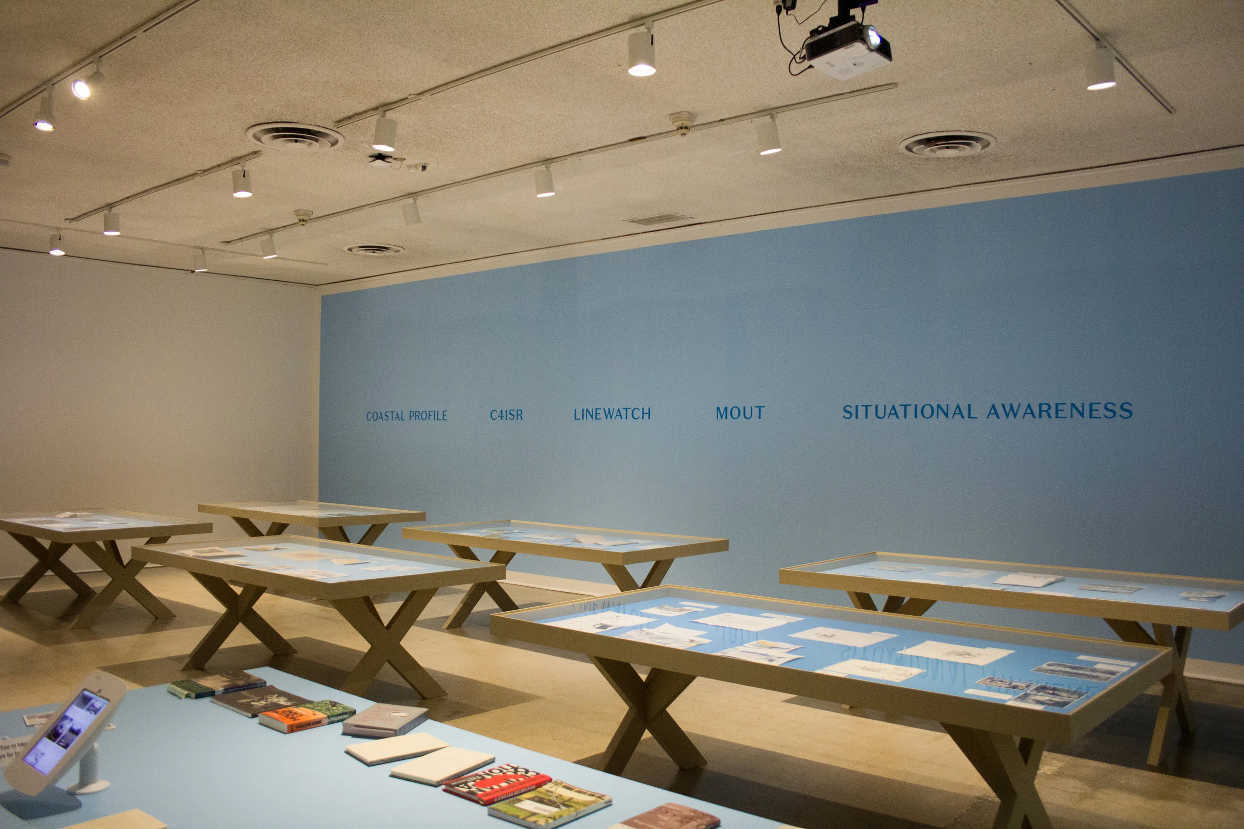 Tables from Incendiary Traces each detail different locales that Mushkin and others explored through art and public research. Photo by Christopher Santee.