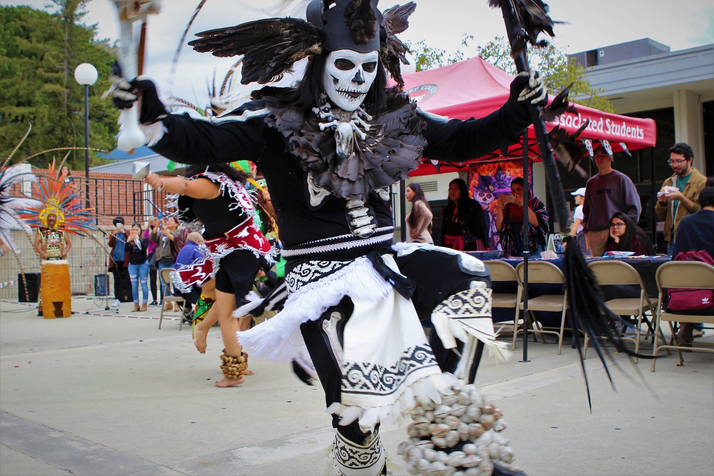  Eduardo Tzotzo, a member of the Danzantes del Sol, performs during the Day of the Dead celebration held at Chaffey College on November 2, 2017. Photograph by Joshua Gutierrez. 