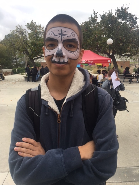  Dental assistant major, Eduardo Becerril's shows off his face paint during the Día De Los Muertos event on Chaffey's Rancho Cucamonga campus. The calavera face painting is a traditional aspect of the Día De Los Muertos event in Mexico.&nbsp; 