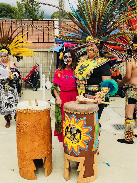  Danzantes del sol dancers pose in traditional Mihtotiqueltl clothing 