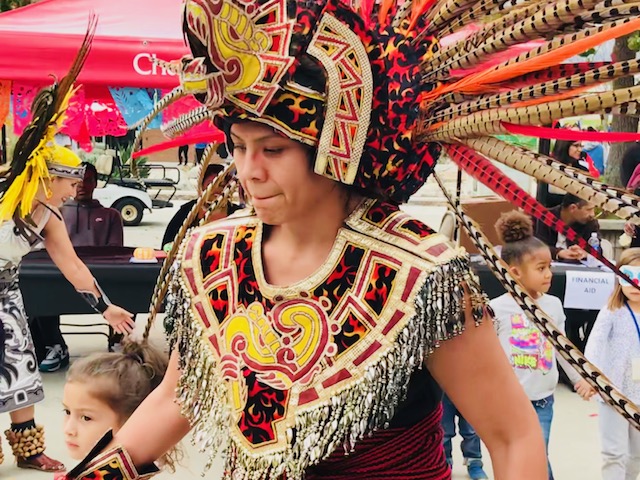  Danzantes del sol dancer invites along children to dance for Chaffey College’s Dia de Los muertos celebration 