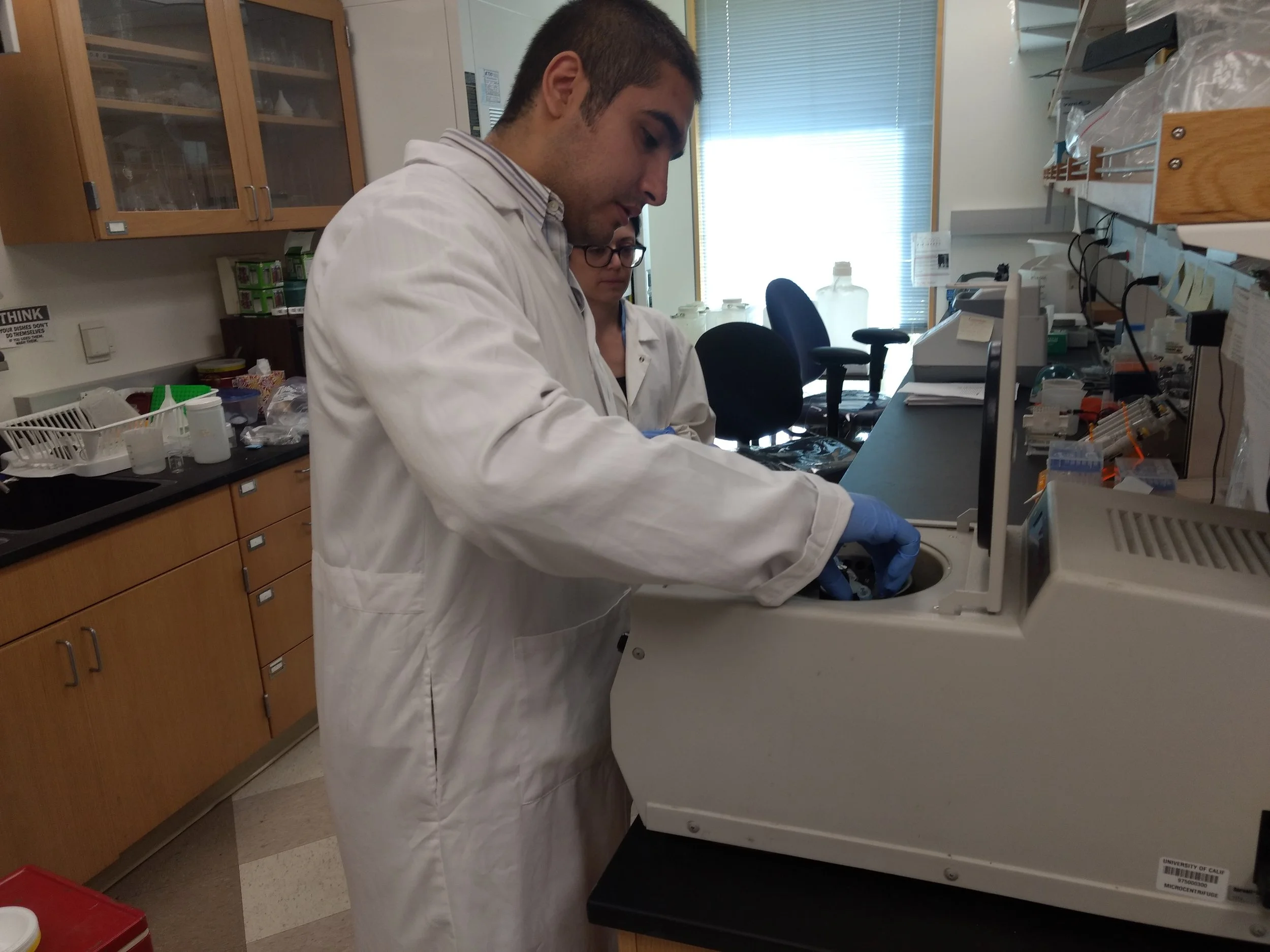 Houssam Nasser using a centrifuge. Photos by Brody Salazar.