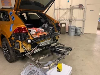 A vehicle hooked up to a dynamometer at UCR Ce-CERT.