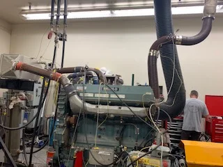 A dynamometer hooked up to an engine for emissions testing.
