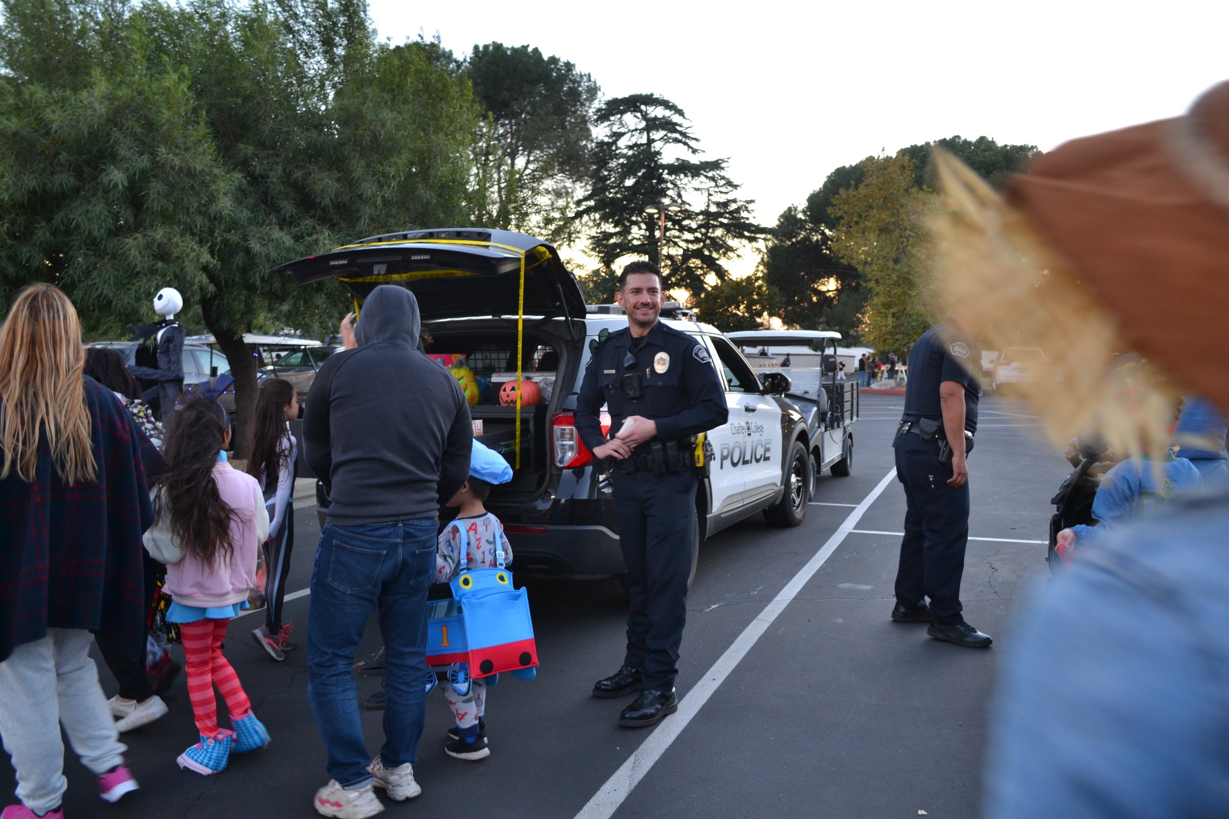 Chaffey College Campus police greet Trick or Treaters. 