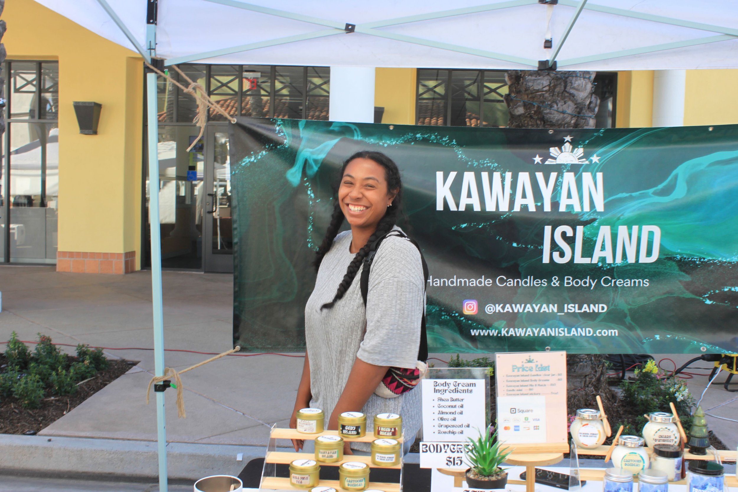  With genuine warmth, the vendor of Kawayan Islands beams at the camera, sharing the artisanal joy of handmade candles and body creams, a snapshot of craftsmanship and natural beauty. Photo by Jess Rodrigo 