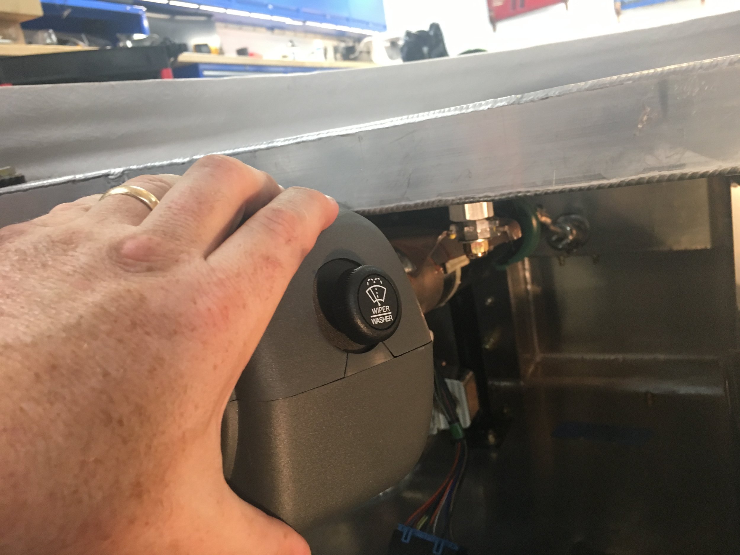 Switch with the upper and lower steering column covers held in place