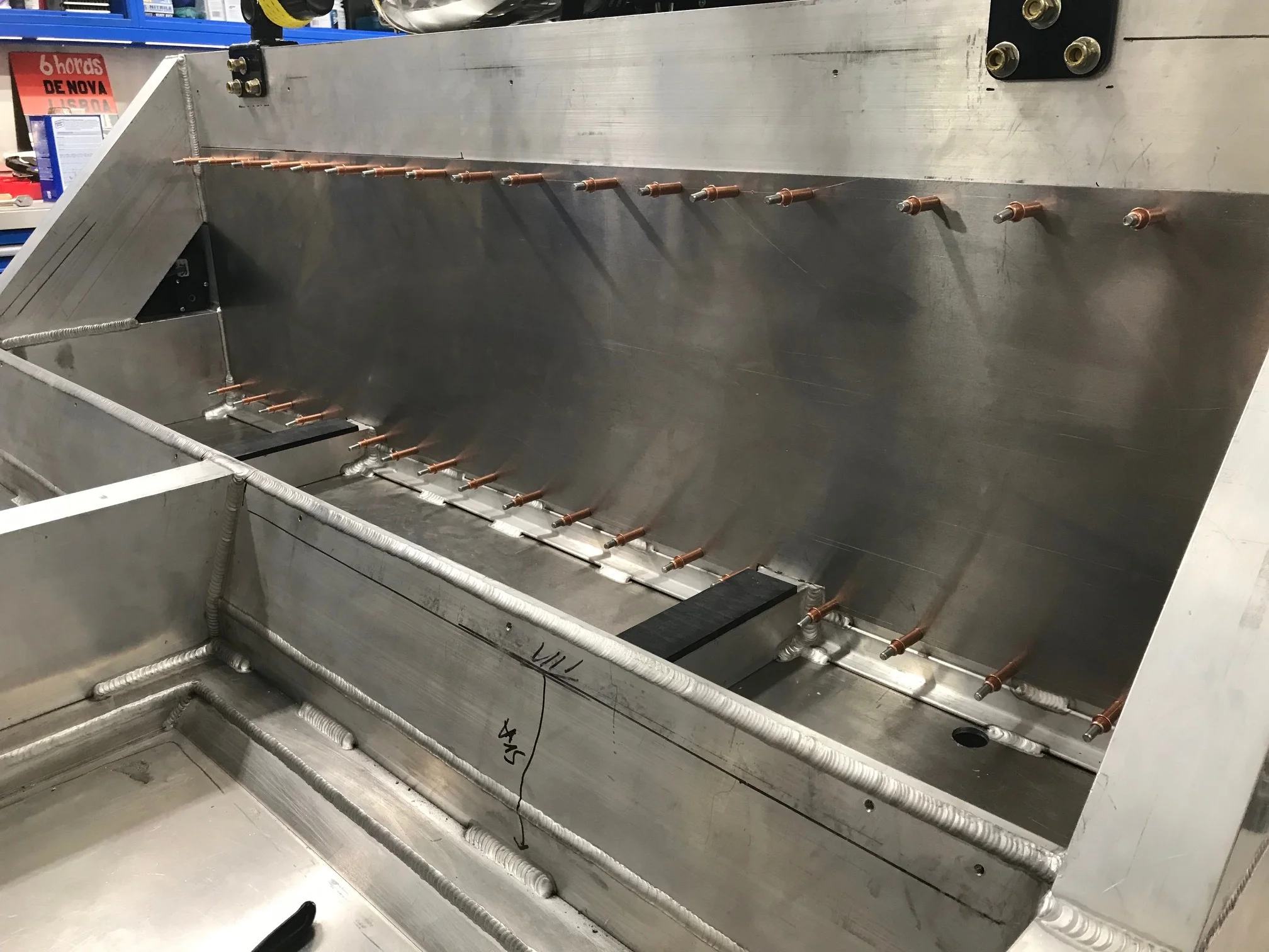 Clecos temporarily holding the panel in place