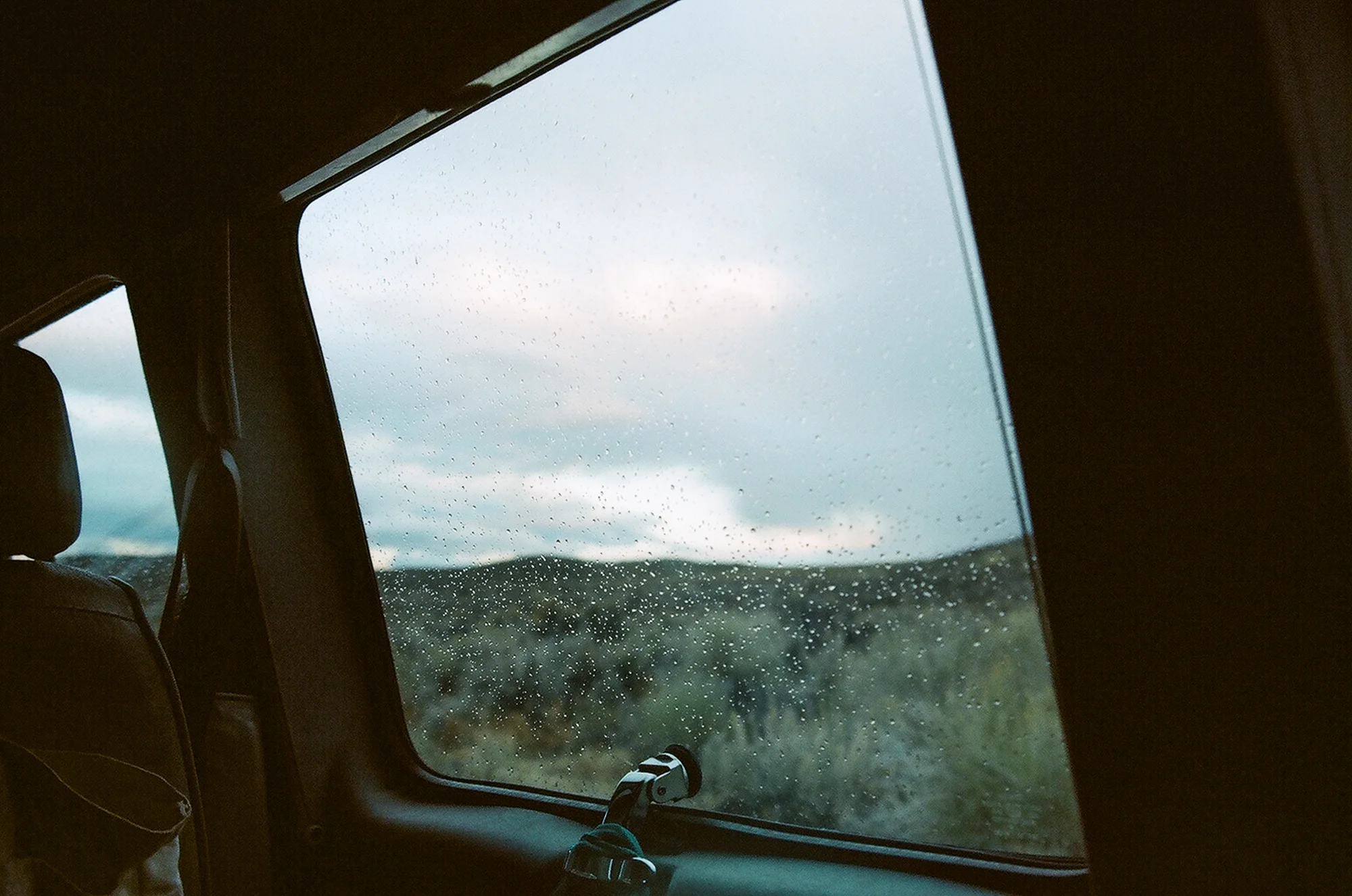 "Follow me. I know of a spot right next to a spring that I think I remember is pretty level. Hopefully no one is around." "What?" Beau asked again, trying to keep the humor alive. We pulled up and spent some time backing up and pulling into the gravel, trying to find the most level ground, an essential vanlife skill. We got it good enough, and started cleaning and organizing our vans for the night. Rain started to sprinkle and the shrubs were doing their wind dance. The sun went down, and I invited Beau over for a movie in my van. He surprised me by buying a copy of The Last of the Mohicans. 