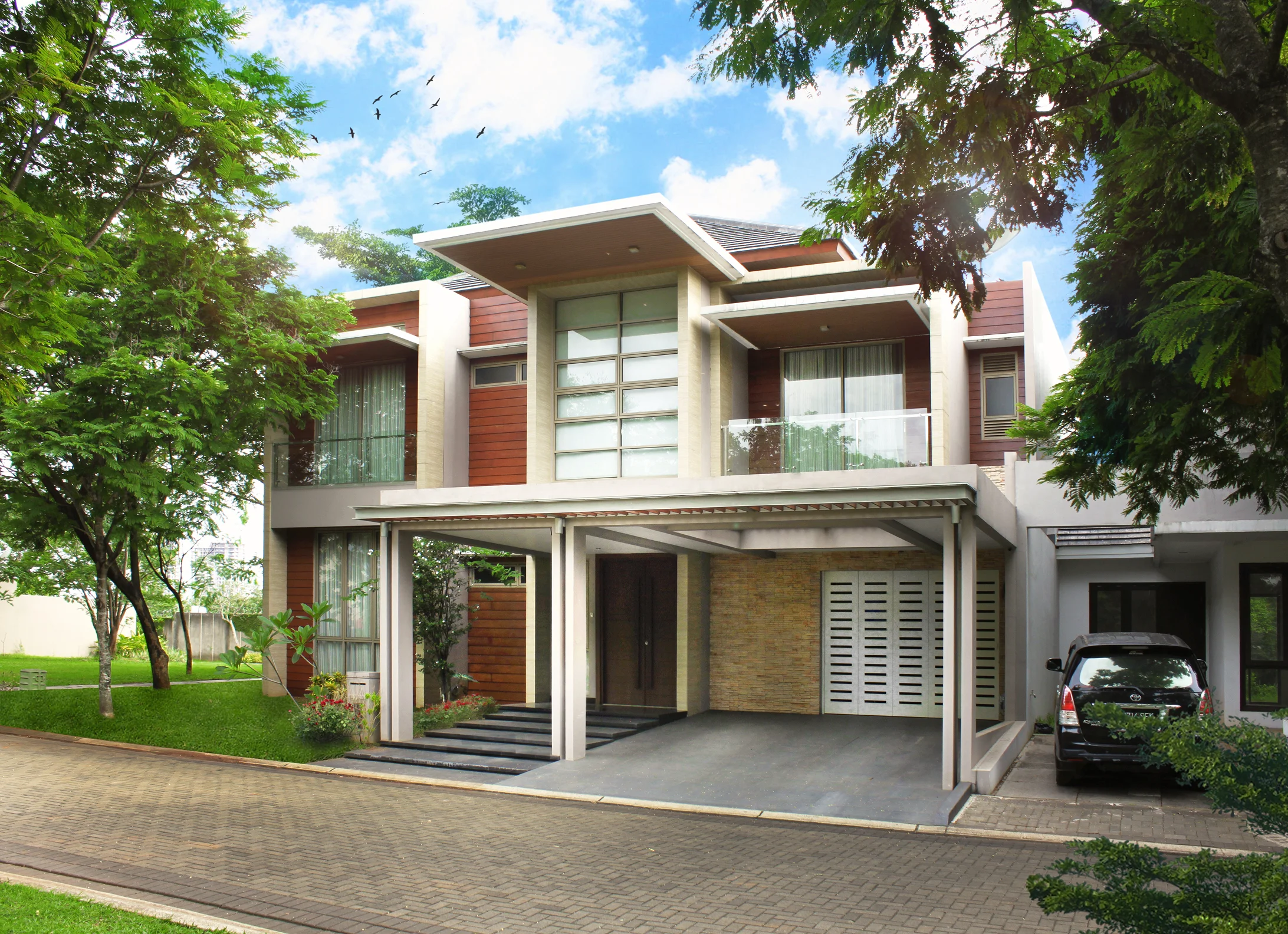 Foresta house is located in BSD City, a simple modern tropical house that plays around with rectangular forms on the facade, topped with a daring 3-meter overhang canopy in the middle portion. The house makes use of synthetic wood on the wall and ceiling for tropical approach, and is paired with artificial ledge stone. Glass railings on the balcony are chosen to create a lighter, sleeker and modern sense to the house.