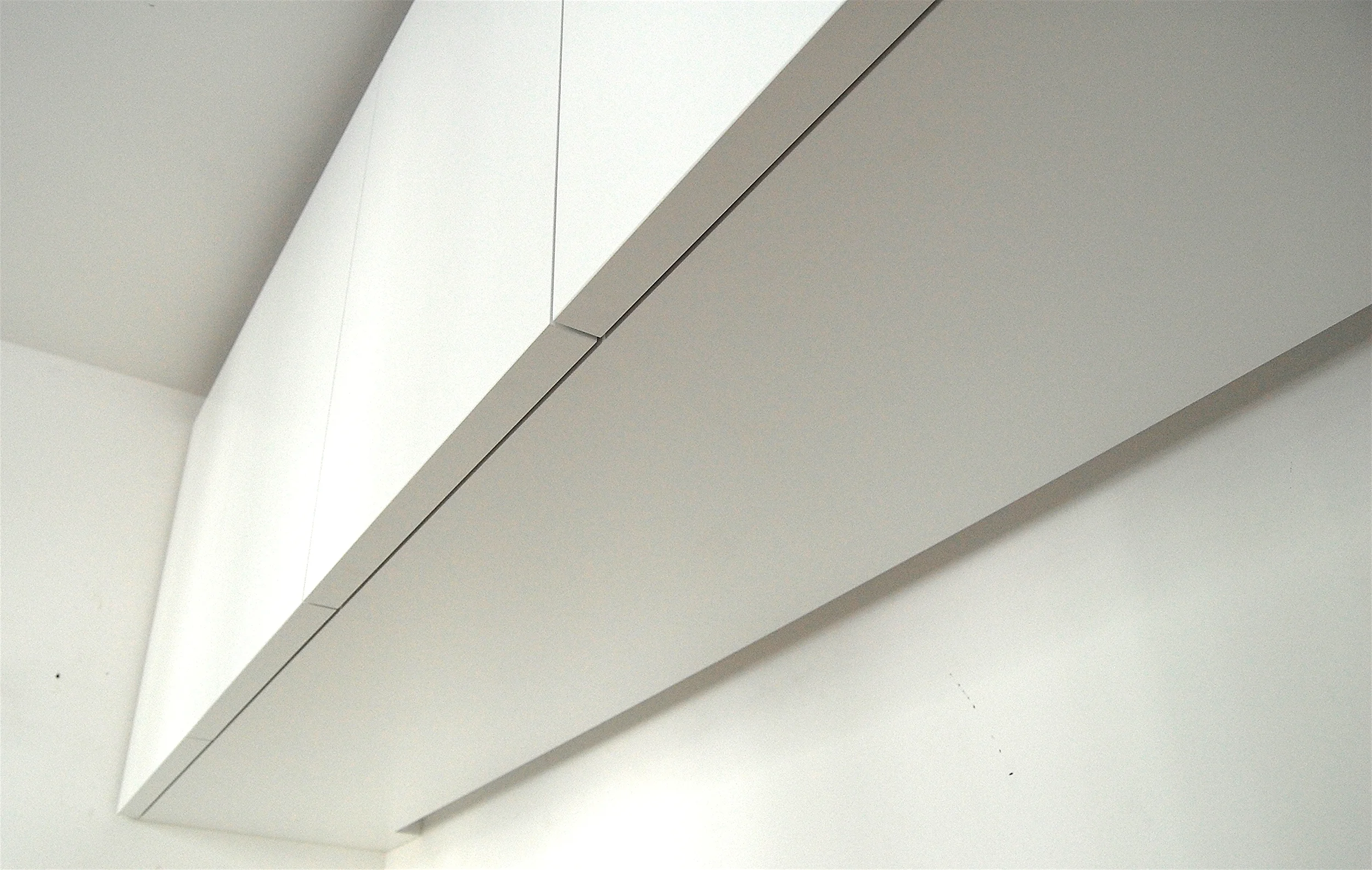 These "edgeless" cabinet doors create a nice seamless flow to the carpentry, seen throughout the home.