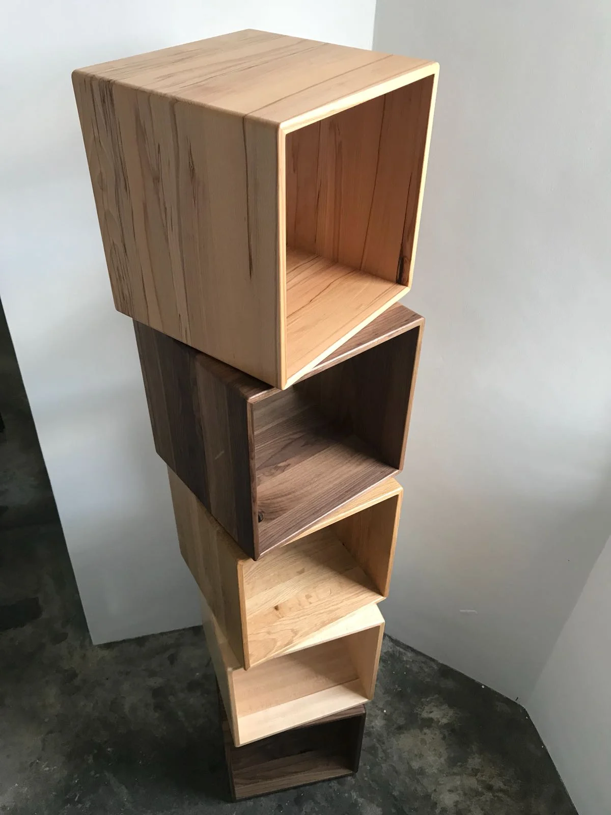 The cubes - shaped using solid Walnut, Oak and Maple.