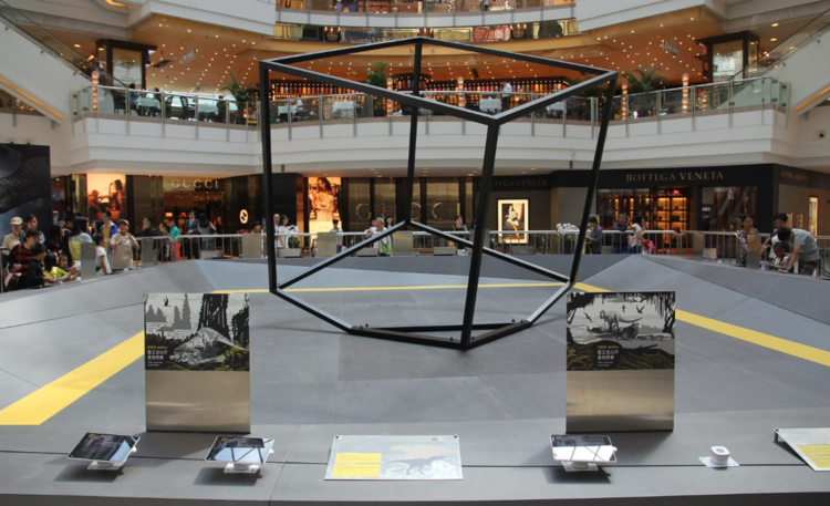 The set design in Asia with a large center cube surrounded by trigger images
