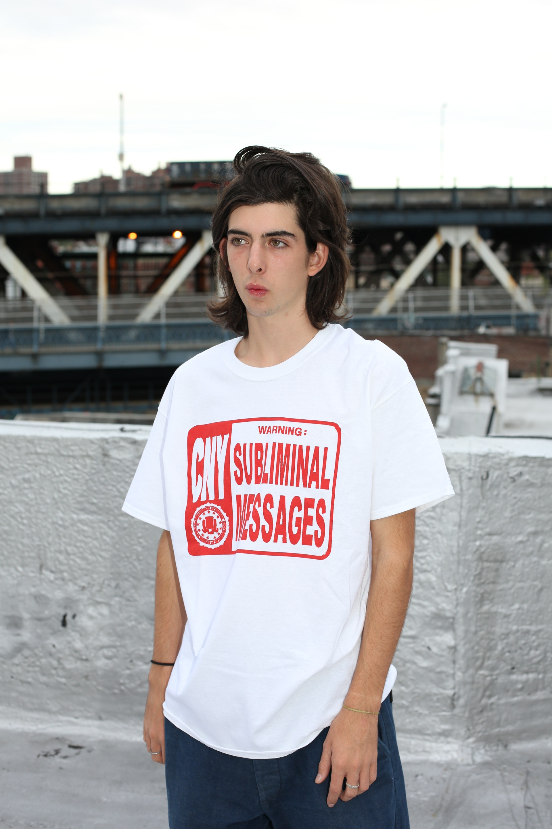tucker wearing red subliminal T in large