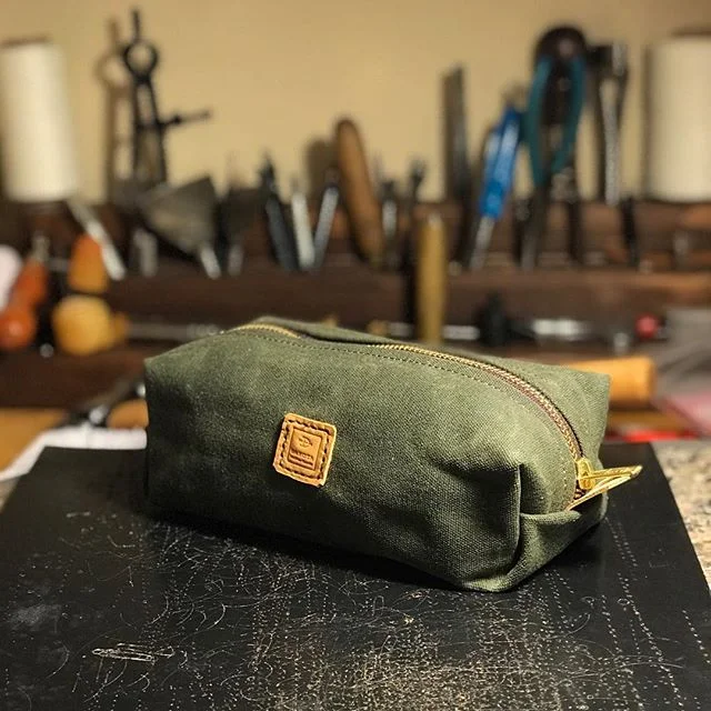 Testing the waters...Hunter green waxed canvas on the singer machine.