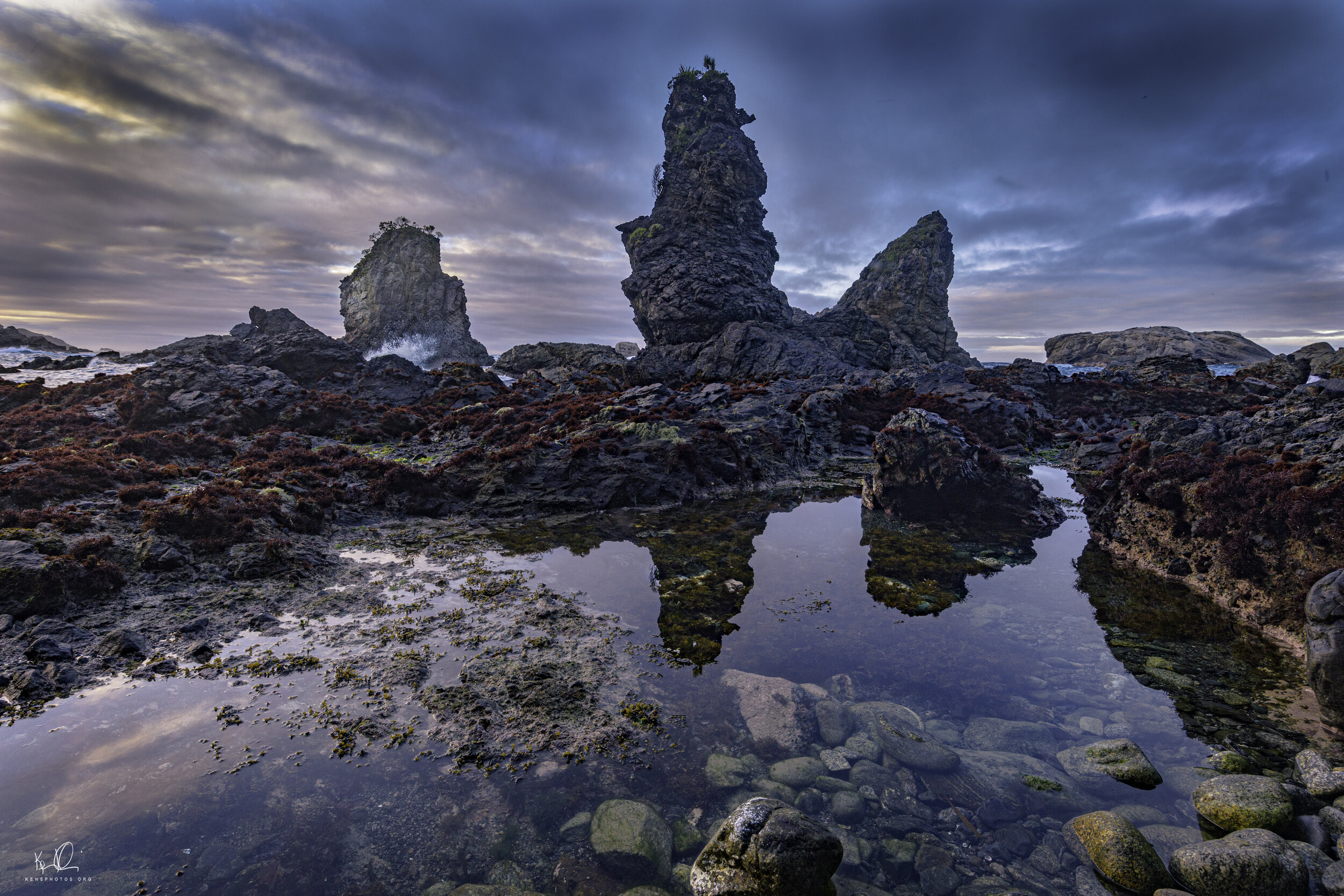   NEW ZEALAND.  I KNOW THE REFLECTION IS GREEN AND THE STACK IS MOSTLY GRAY BUT THE CAMERA DOESN’T LIE.    