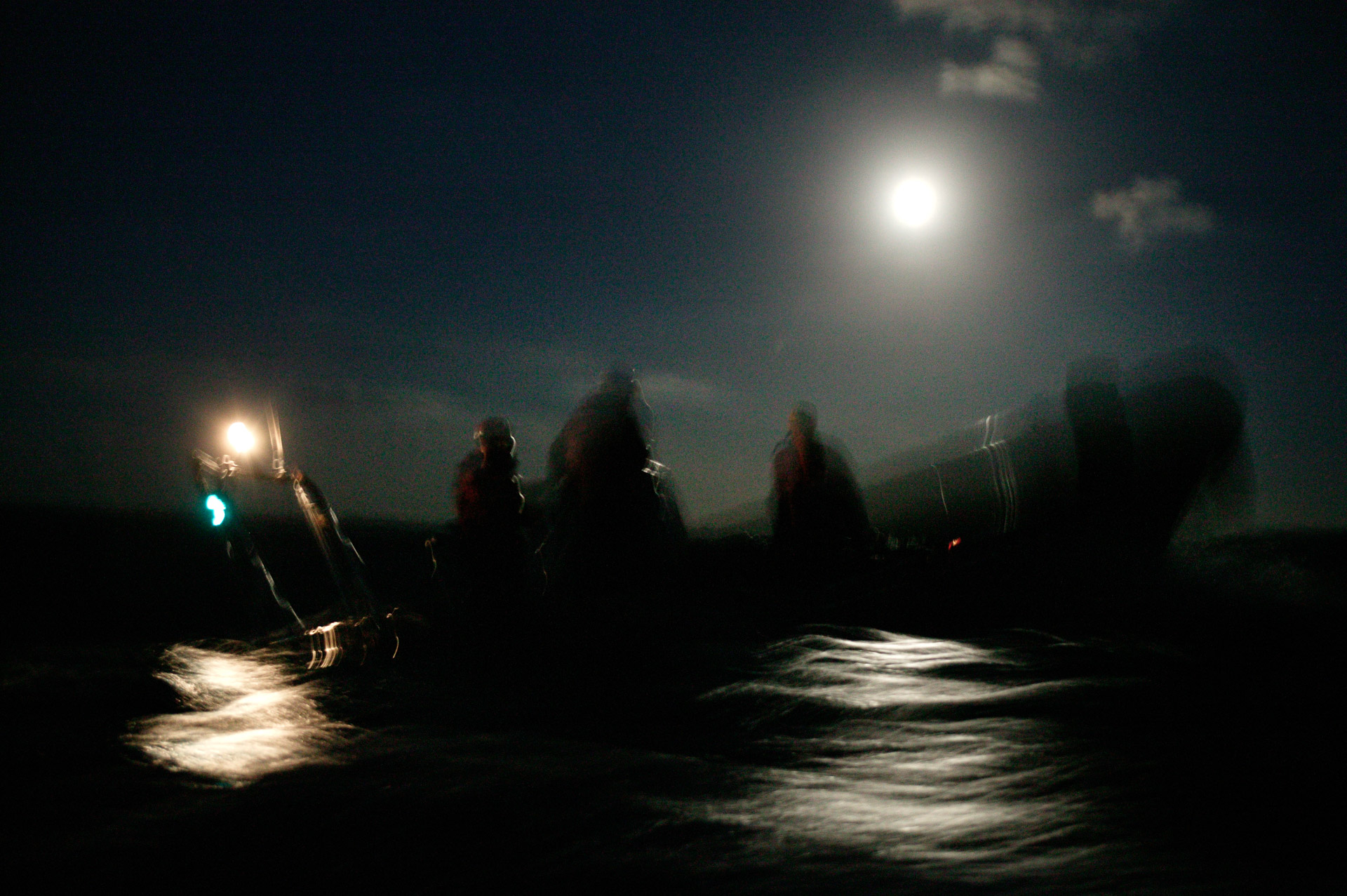 A rib with crew at moonlight