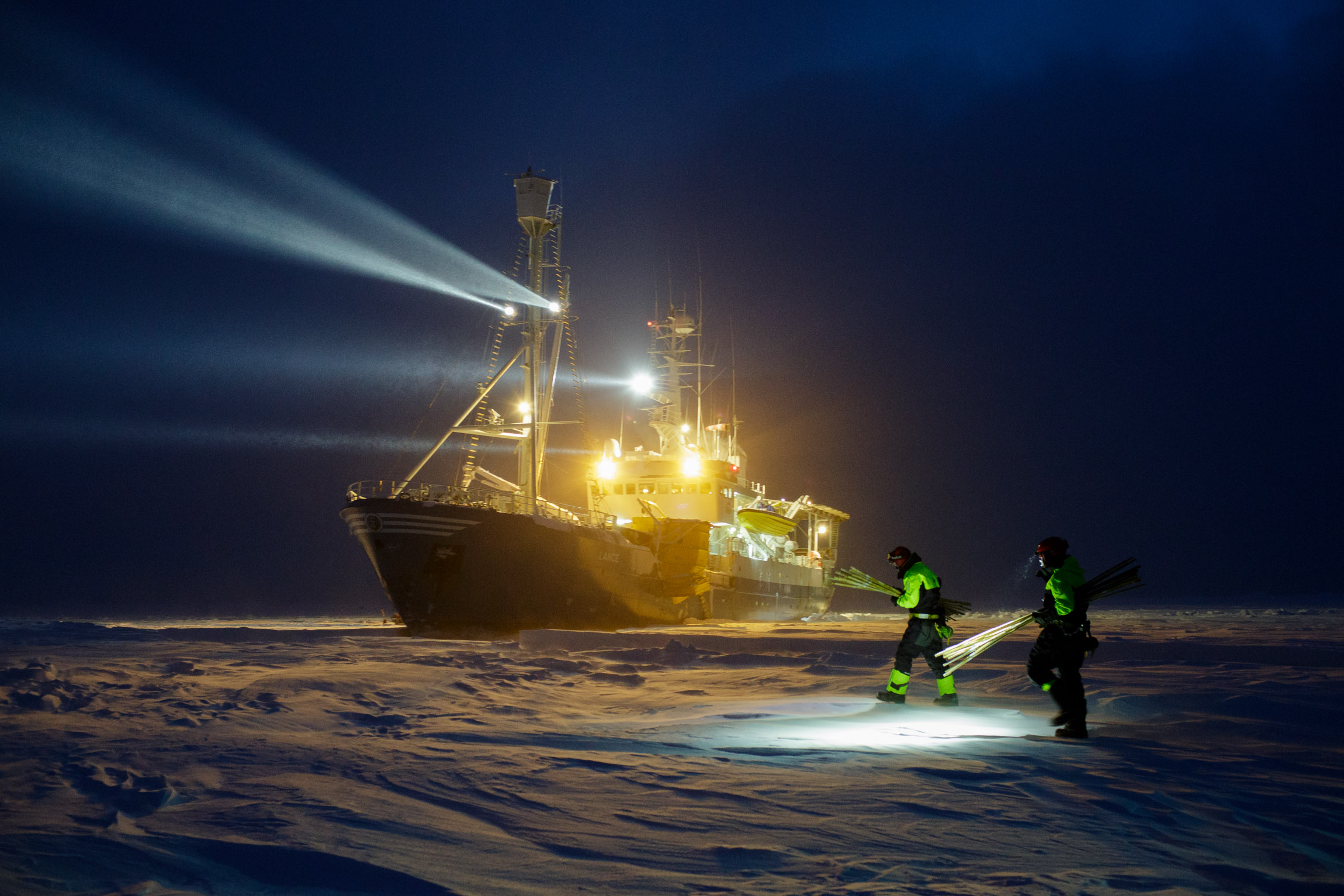 Research ship frozen in with searchlights