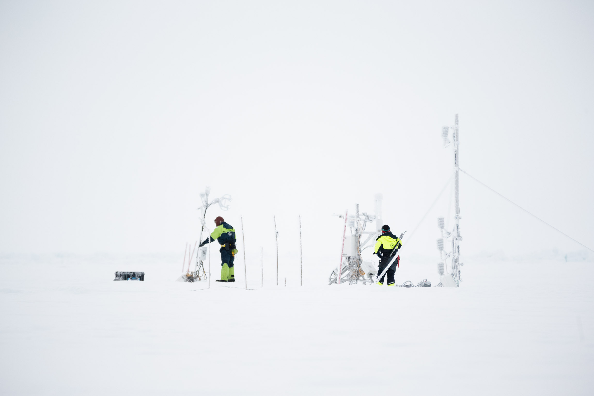 Scientists work with frozen instruments