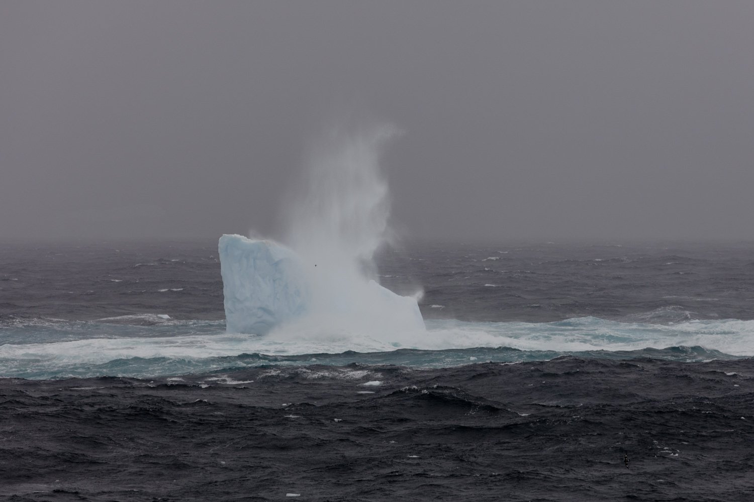 Iceberg hit by waves
