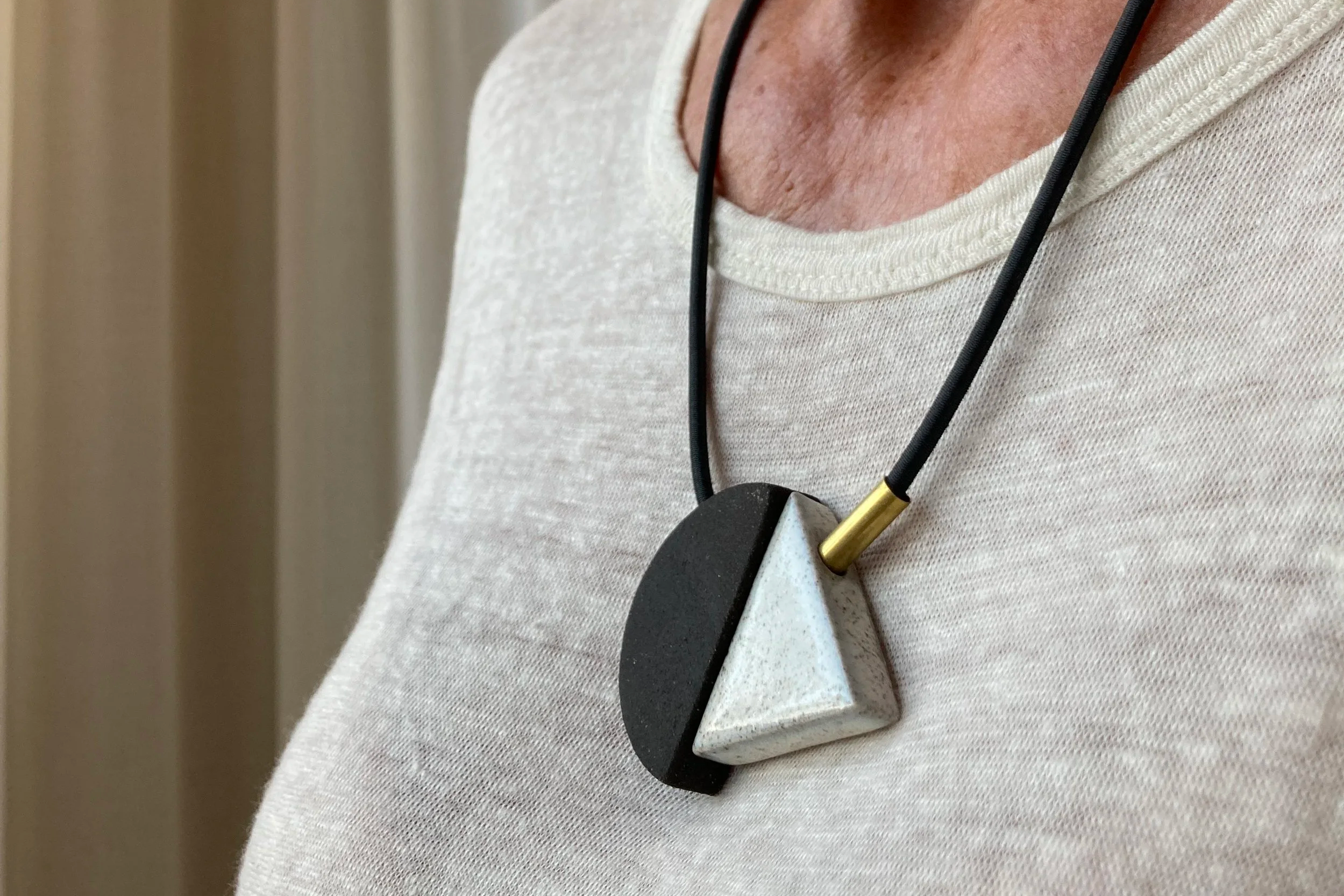 GEO+necklace+triangle+-+on+model+close+-+Studio+Janneke+Ceramics+London.png