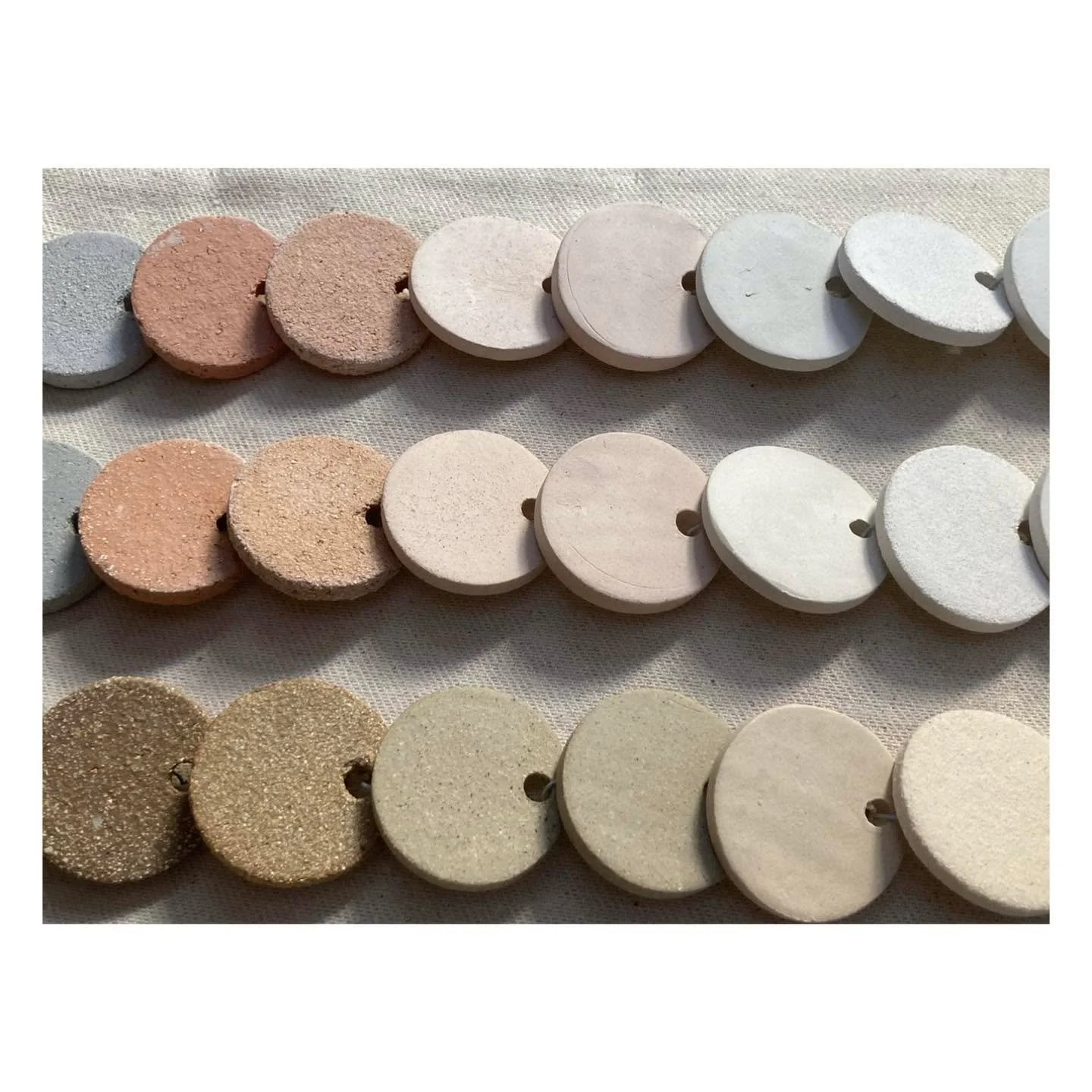 T E S T E R S .

Image from my recent project Better Mistakes Tomorrow: testers in 15 different clays, fired at 1000, 1100 and 1240 degrees.

I love making test tiles and creating pleasing ways to display them. They serve as a reference library and a