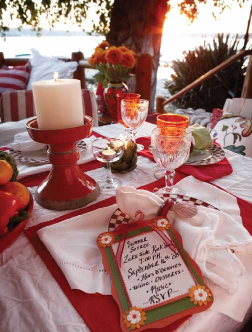 THE RIGHT SETTING INVITES GUESTS TO RELAX AND ENJOY THE TRANSITION TO FALL. FLORAL PILLOWS AND EARTHEN PILLAR CANDLEHOLDERS (POTTERY BARN, POTTERYBARN.COM); WHITE AND STRIPED PILLOWS AND GOBLETS (RALPH LAUREN HOME COLLECTION, RALPHLAURENHOME.COM); PLATES (MACKENZIE-CHILDS TABLEWARE & HOME FURNISHINGS, MACKENZIE-CHILDS.COM); NAPKINS, NAPKIN RINGS, AND BOUQUET (MOLBAKS, 13625 N.E. 175TH ST., WOODINVILLE, MOLBAKS.COM).