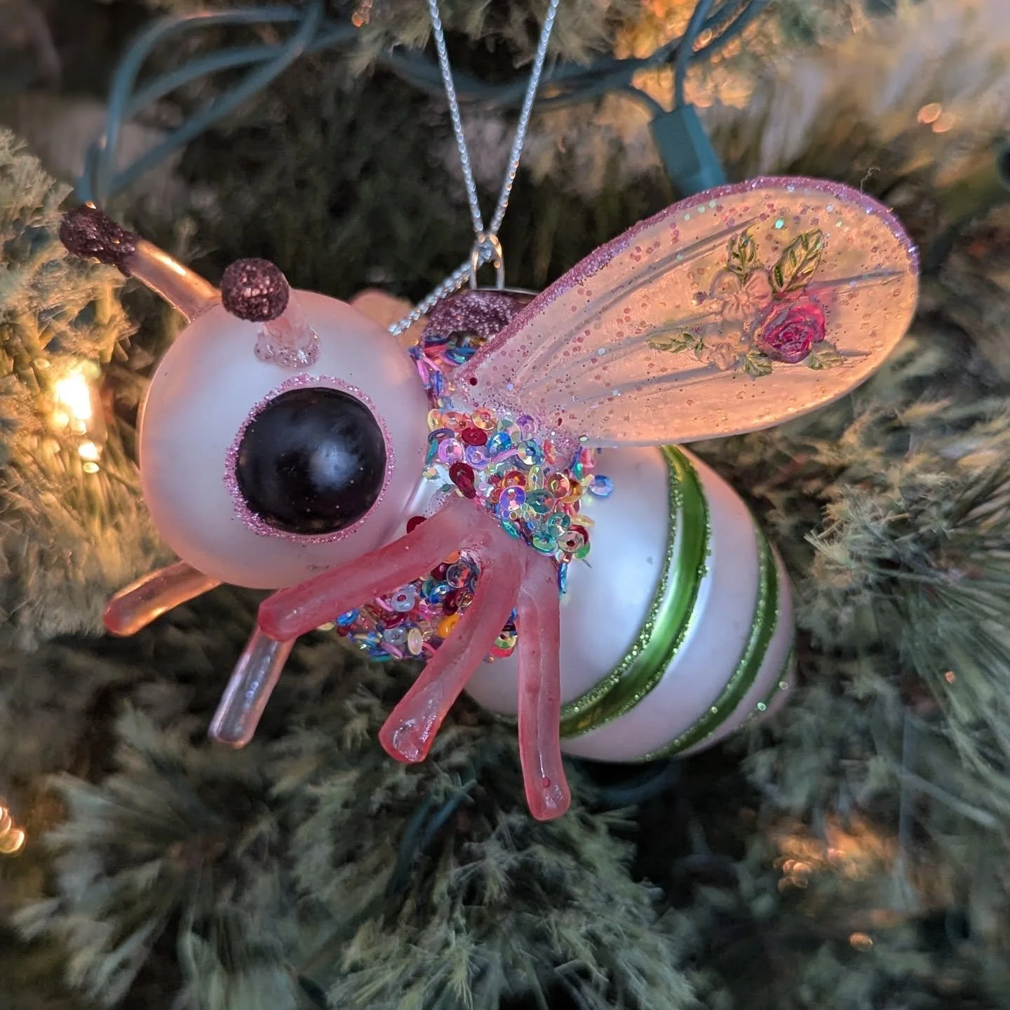 This ornament arrived in the mail yesterday from my former supervisor. I was shocked!! I have never seen a bee like it! People know me too well 😅🐝🥰🎄 added to my honey bee themed ornament collection! I love the roses on her wings!