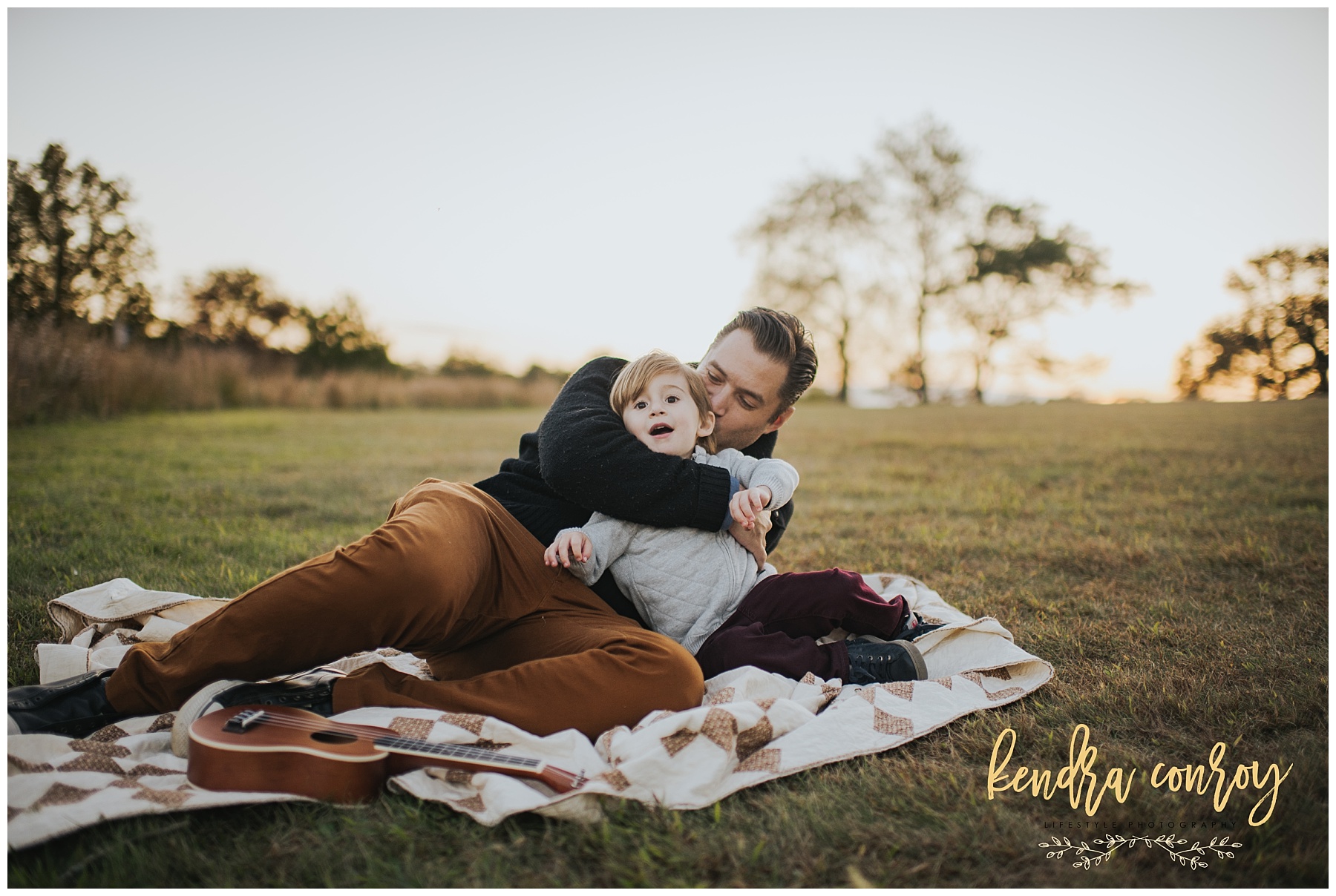 Dad and little son hugging at New Canaan park in Connecticut Kendra Conroy Photography