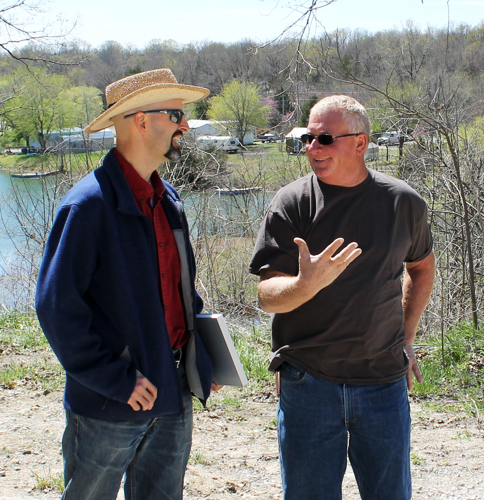 Shafer, Kline & Warren Team Leader Matt Eblen (left) discusses dam and stormwater management with Tanglewood Lakes Board Member Robert Lawrence (right) during a routine inspection.