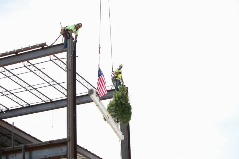JE Dunn crews place the last structural beam on the new Lenexa Civic Center.