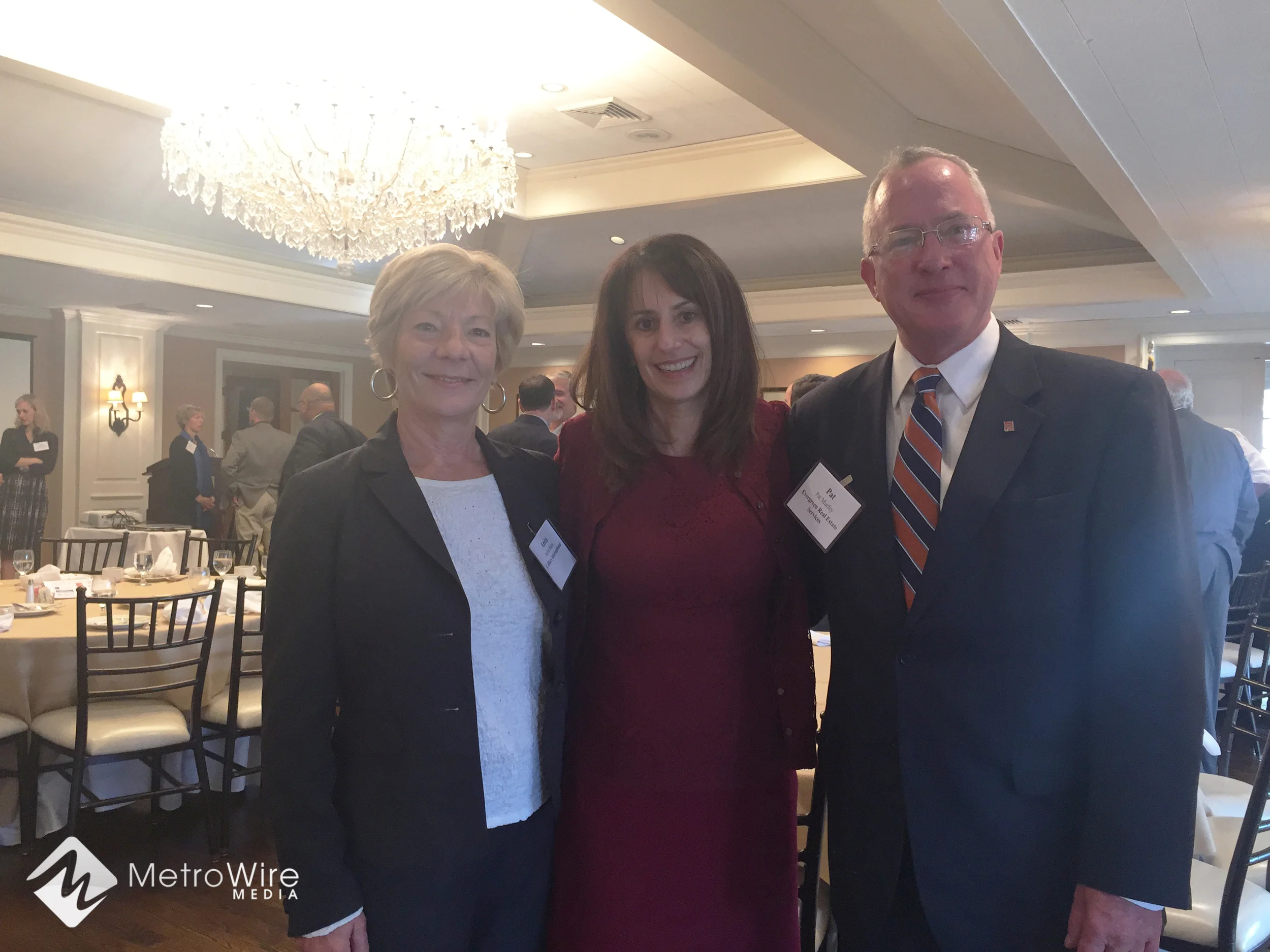 Ora Reynolds, president and CEO of Hunt Midwest, visits with CCIM Kansas City on Friday morning along with Anita Bates, Colliers (left) and Pat Murfey, Evergreen Real Estate Services.