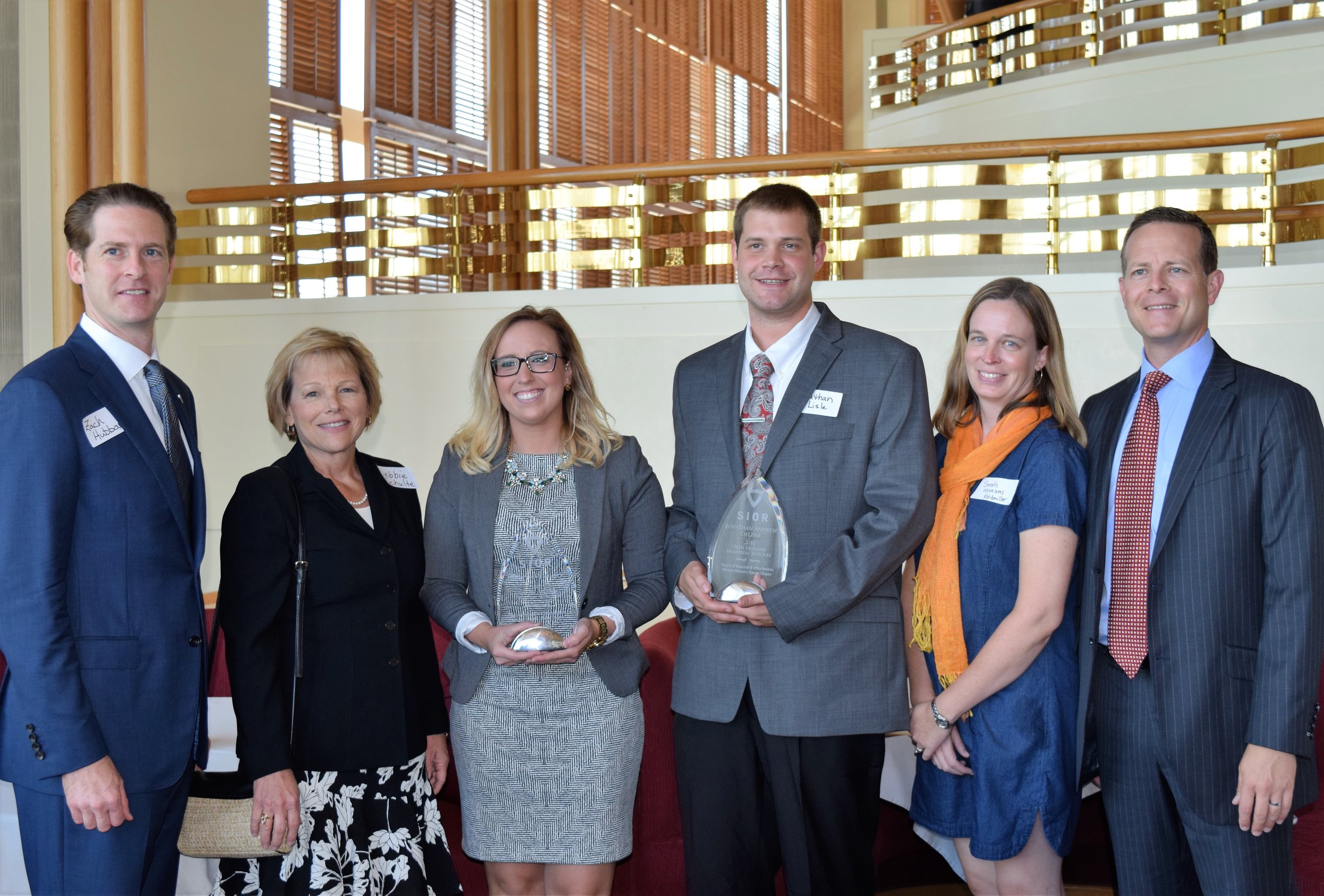 Left to right: Zach Hubbard, SIOR Scholarship Chairman; Debbie Schulte, SIOR Vice President/Treasurer; Christina Fenwick, Mary Riley-Cheek Memorial Scholar; Jonathan DeLisle, Olen Monsees Memorial Scholar; Sarah Feldmiller, daughter of late Olen Monsees; Nathan Anderson, SIOR President