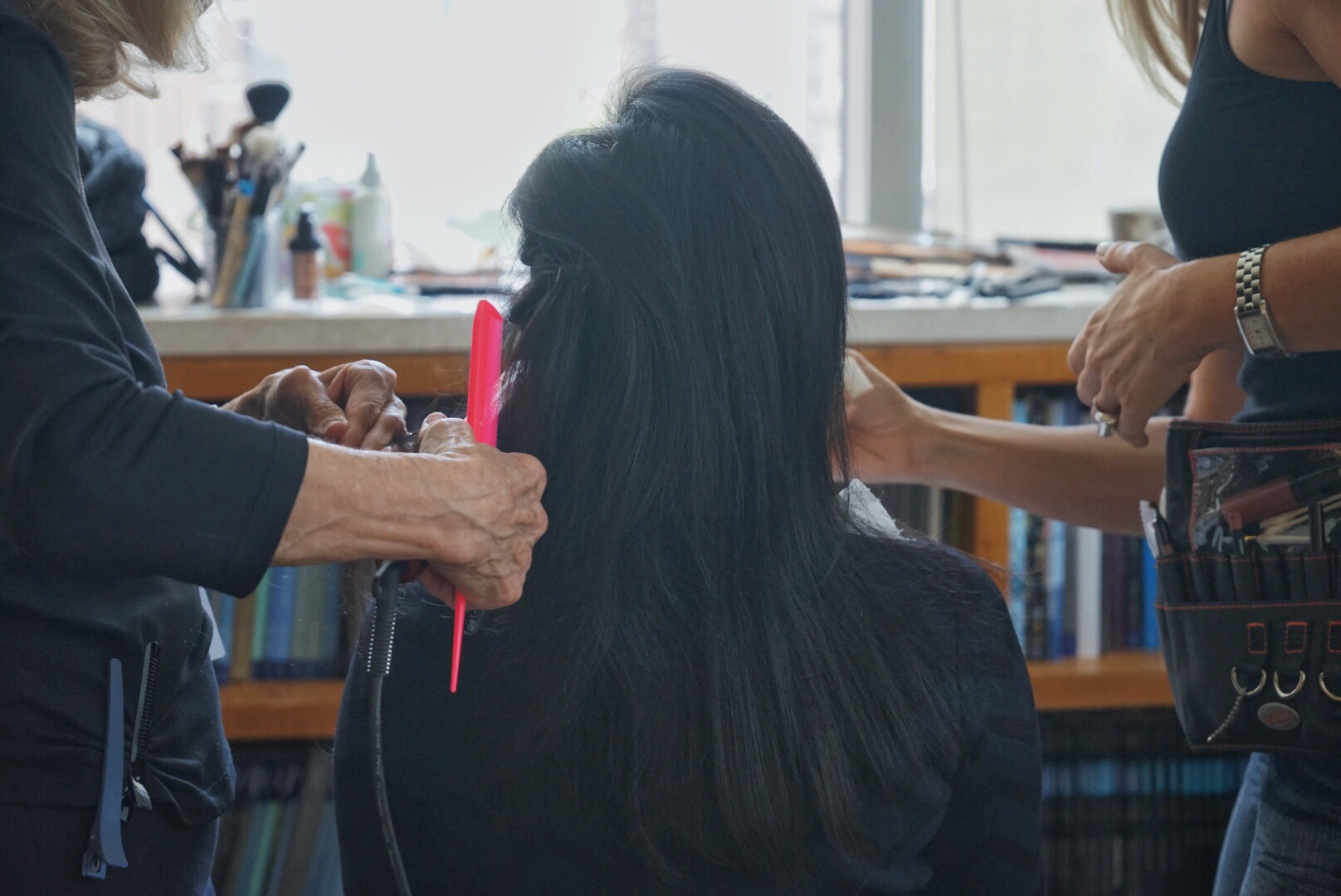 Hitha Herzog getting her hair teased and combed. 