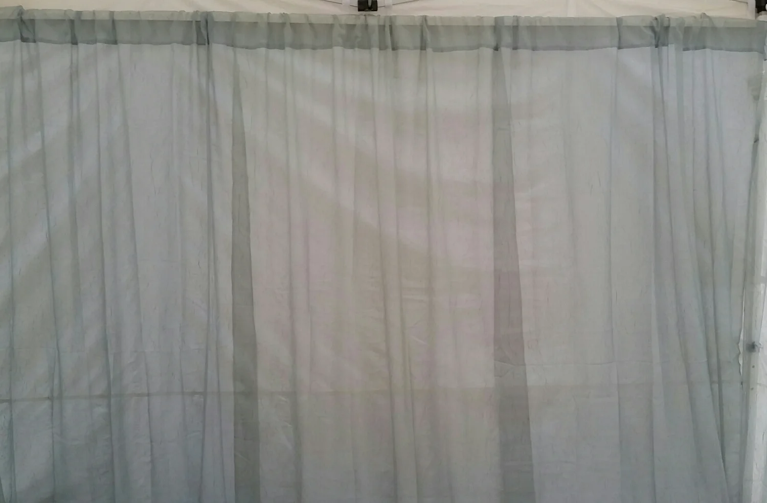 We recently redesigned the booth and these curtains were a new bit of color. They are a pale green and with the sunlight in the booth, they add the perfect touch.