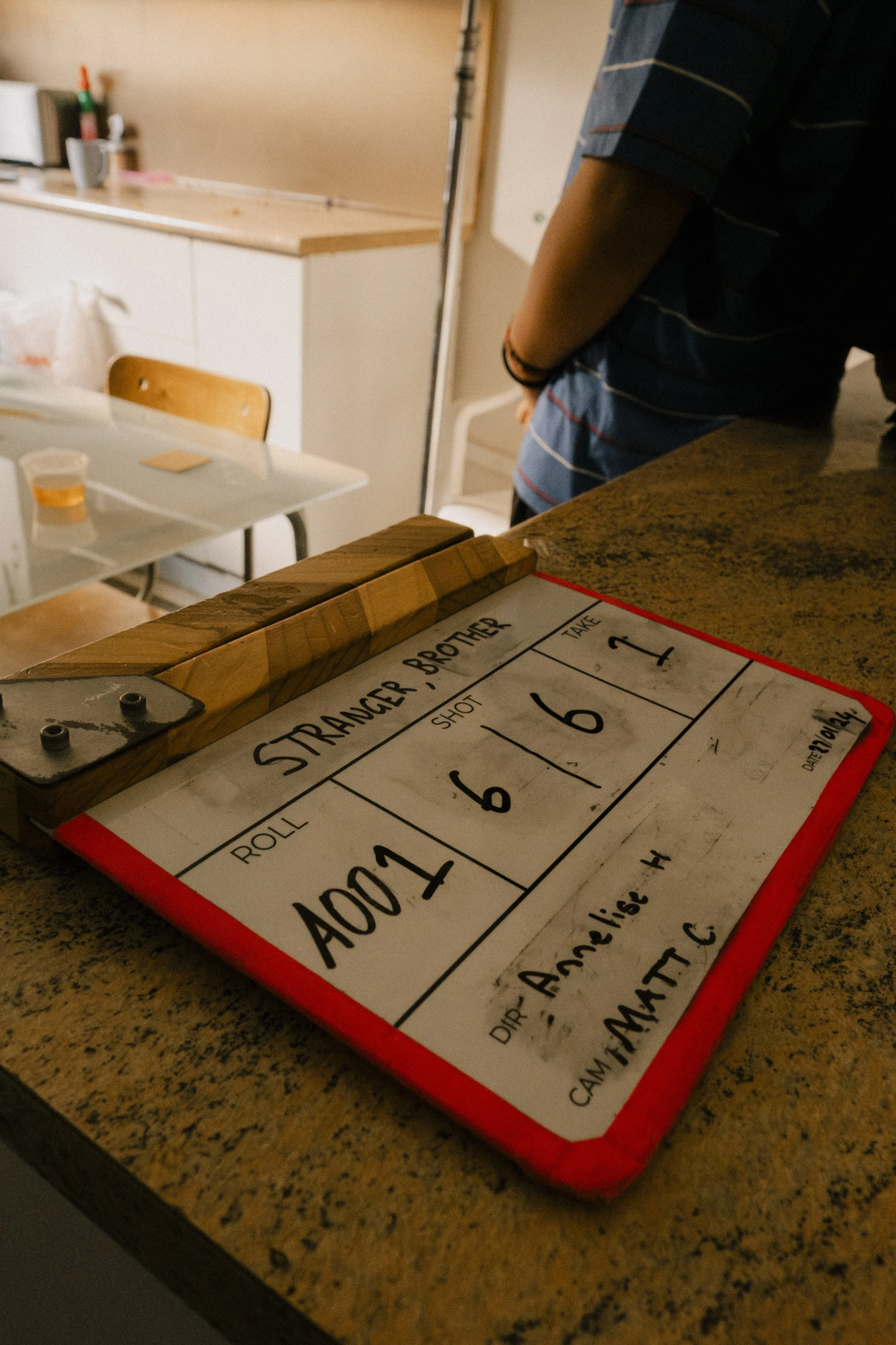 A film slate, unit still from the short film Stranger Brother.