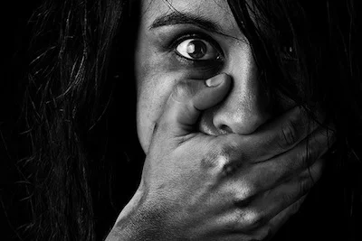 Woman_hand_over_mouth.jpg