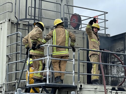 Fire fighting training drills inside mocked up ships